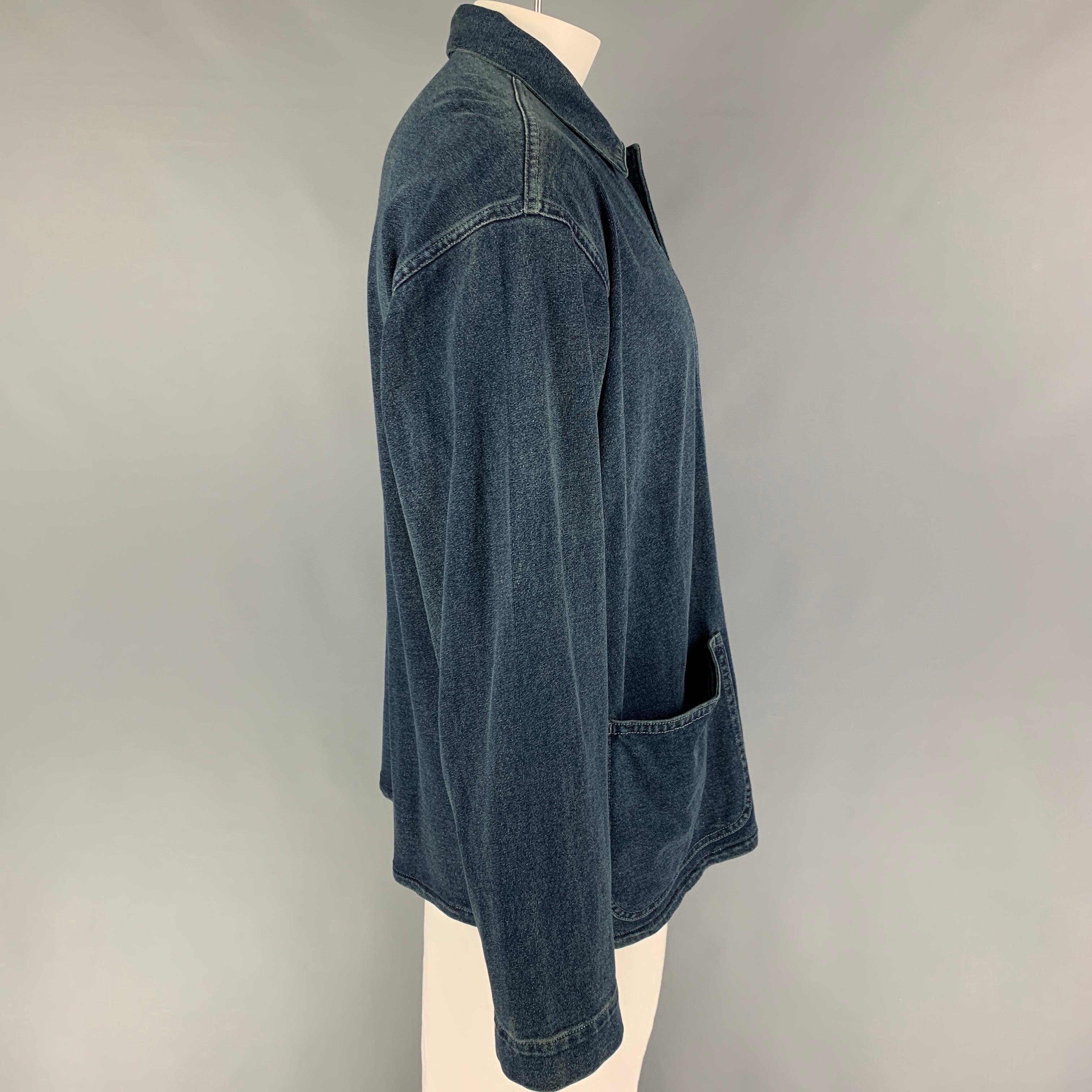 RRL by RALPH LAUREN jacket comes in a dark blue cotton featuring a spread collar, patch pockets, contrast stitching, and a buttoned closure. 

Very Good Pre-Owned Condition.
Marked: XL

Measurements:

Shoulder: 23.5 in.
Chest: 48 in.
Sleeve: 26