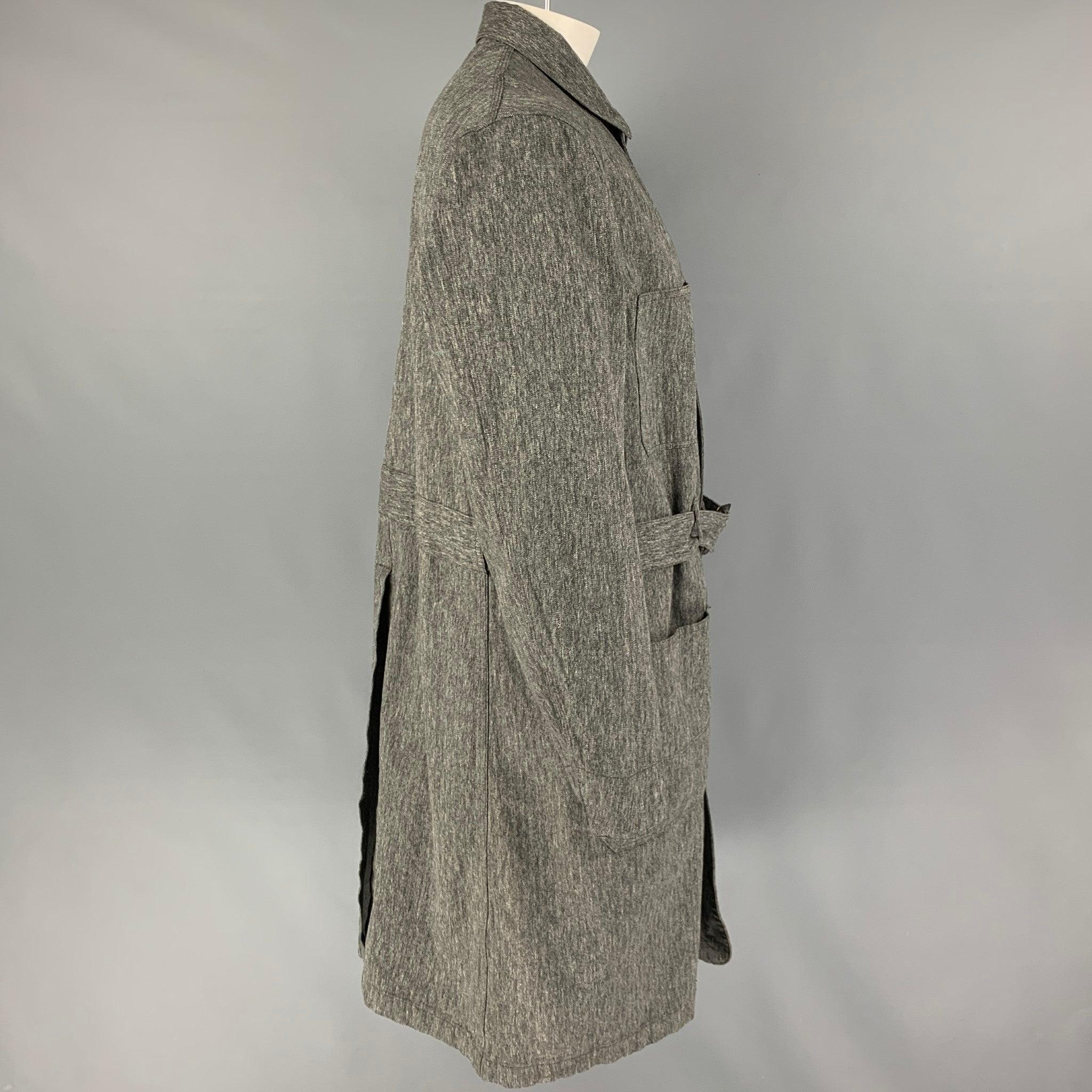 RRL by RALPH LAUREN 'Limited Edition' coat comes in a gray herringbone cotton featuring a belted style, patch pockets, single back vent, and a hidden placket closure.
Excellent
Pre-Owned Condition. 

Marked:  XL 

Measurements: 
 
Shoulder: 19.5