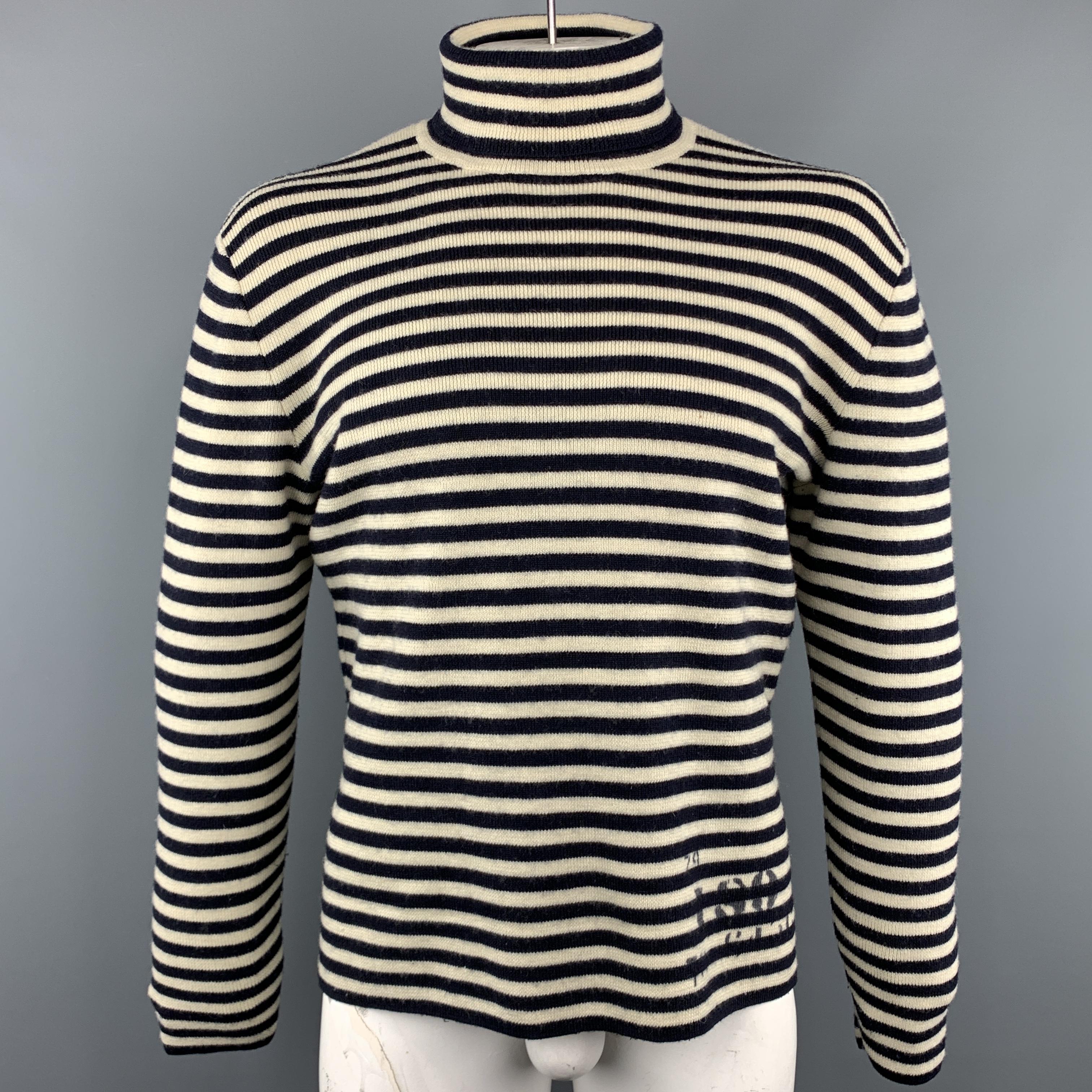 RRL by RALPH LAUREN sweater comes in a navy and cream striped wool featuring a turtleneck style, graphic details, and two side slits.
 
Excellent Pre-Owned Condition.
Marked: XL
 
Measurements:
 
Shoulder: 21 in.
Chest: 50 in.
Sleeve: 26.5