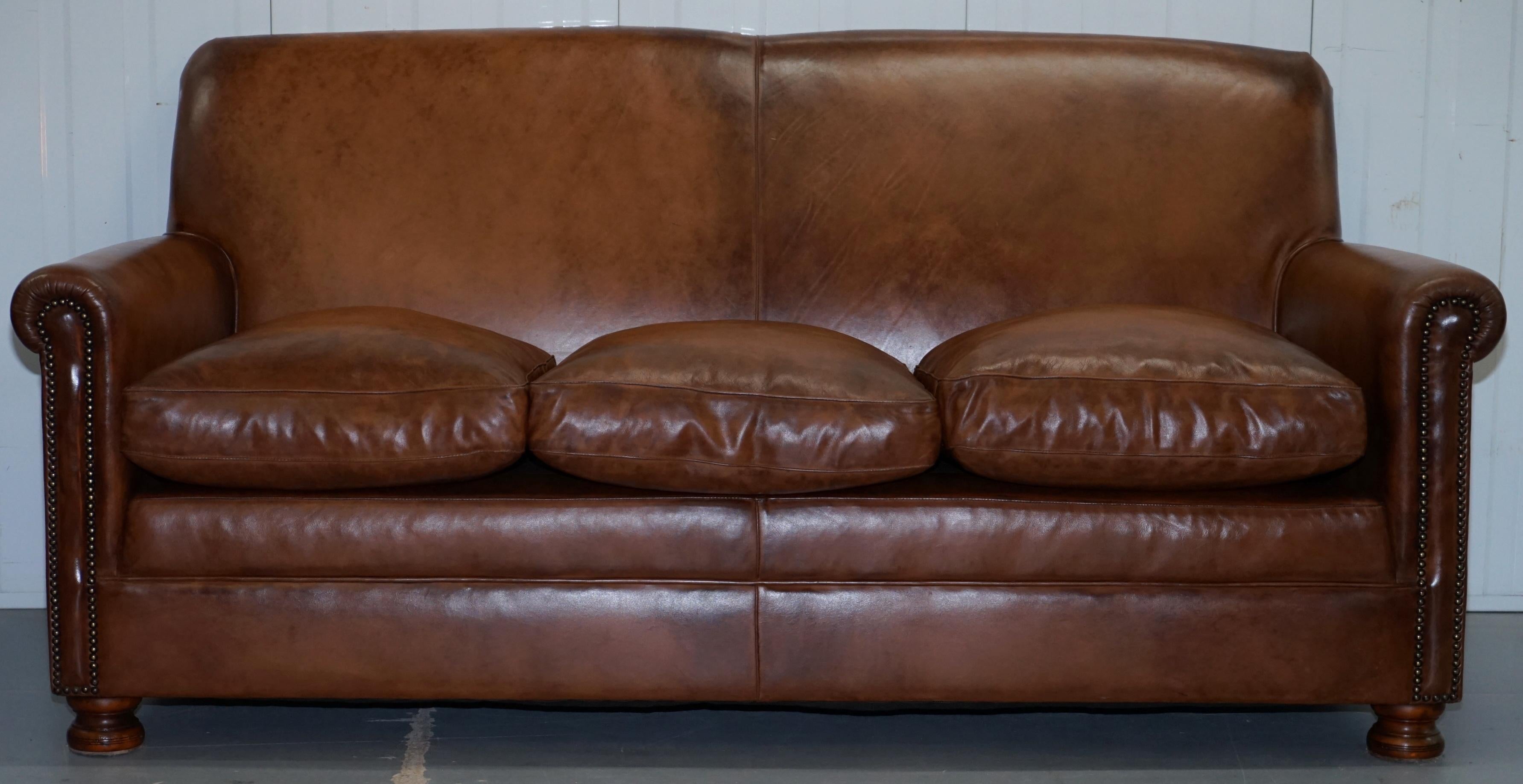 We are delighted to offer for sale this RRP £3250 handmade in England Tetrad price brown leather three-seat sofa with feather filled cushions

The sofa has medium filled feather cushions so its very comfortable, the leather finish is antiqued and