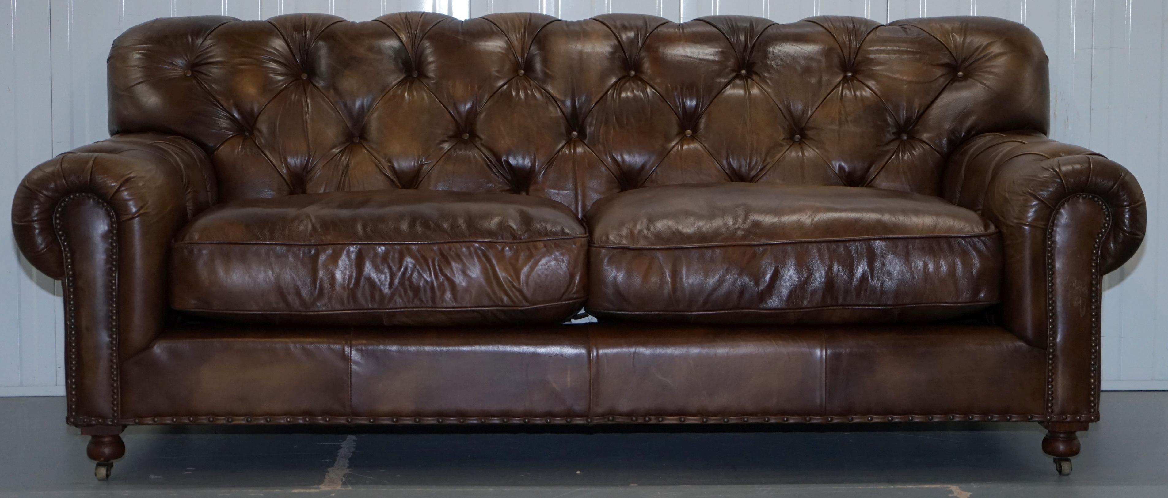 We are delighted to offer for sale this lovely original Timothy Oulton aged brown leather Chesterfield three seater sofa with huge deep heavy feather filled cushions RRP £4499.

A very good looking and comfortable sofa, this model isn’t around