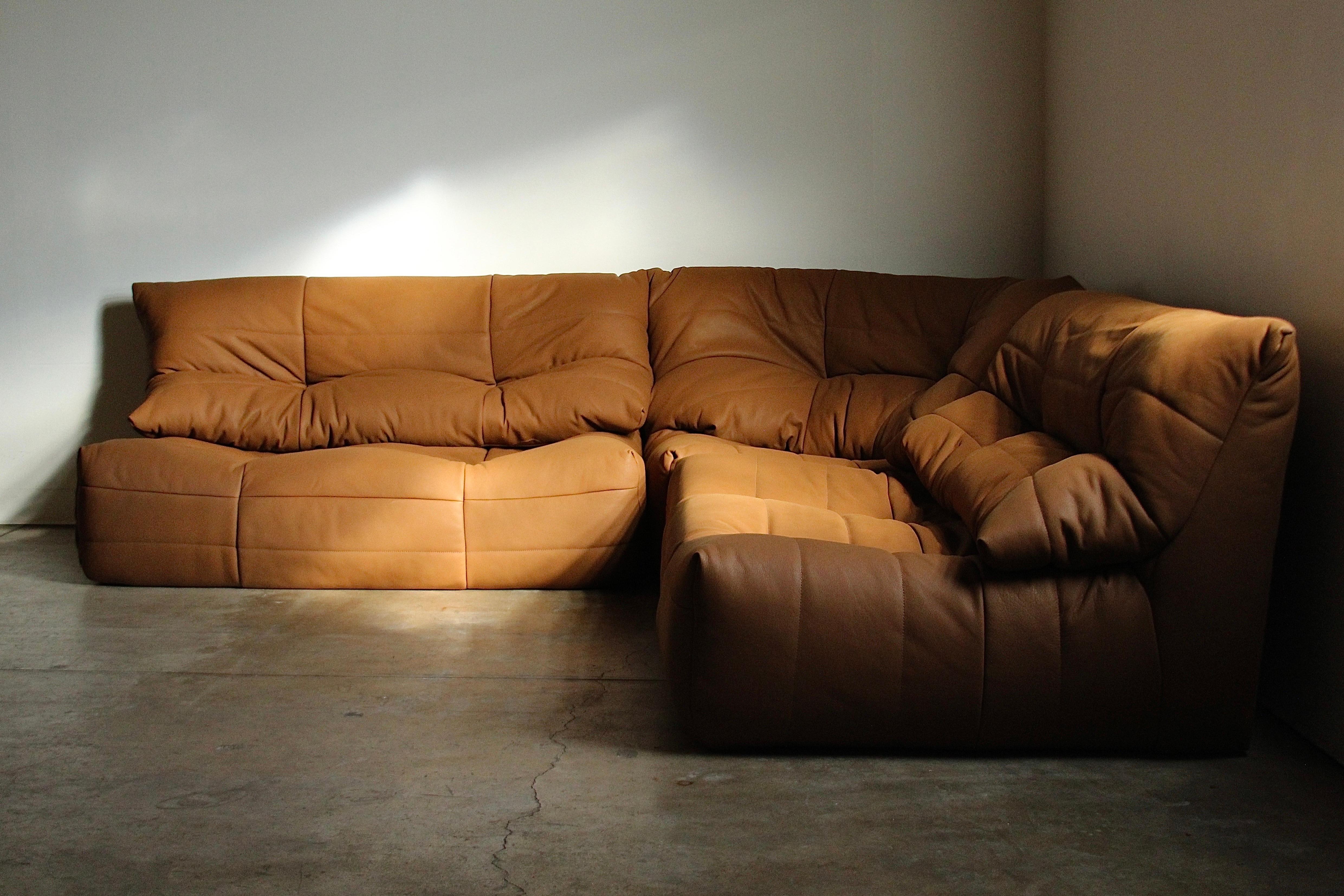 An absolute masterpiece, this divine, utterly rare sofa was designed and manufactured by R.S. Associates in Montreal in the 1970s. It consists of 3 pieces including 2 identical loveseats and a large corner piece. It can be used together as shown, or