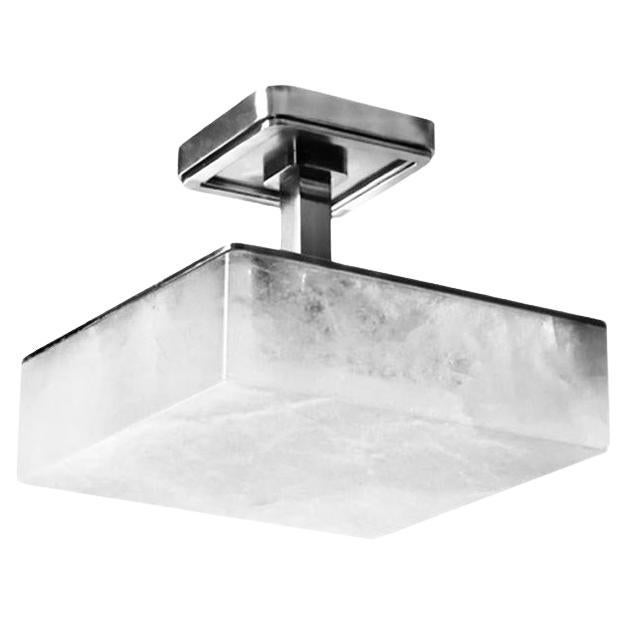 Paire de semi-encastrés en cristal de roche avec une monture en nickel poli. Trois prises de bougies installées.
180 W au total, fournis par Phoenix Gallery. 
Taille et finition du métal sur mesure sur demande.