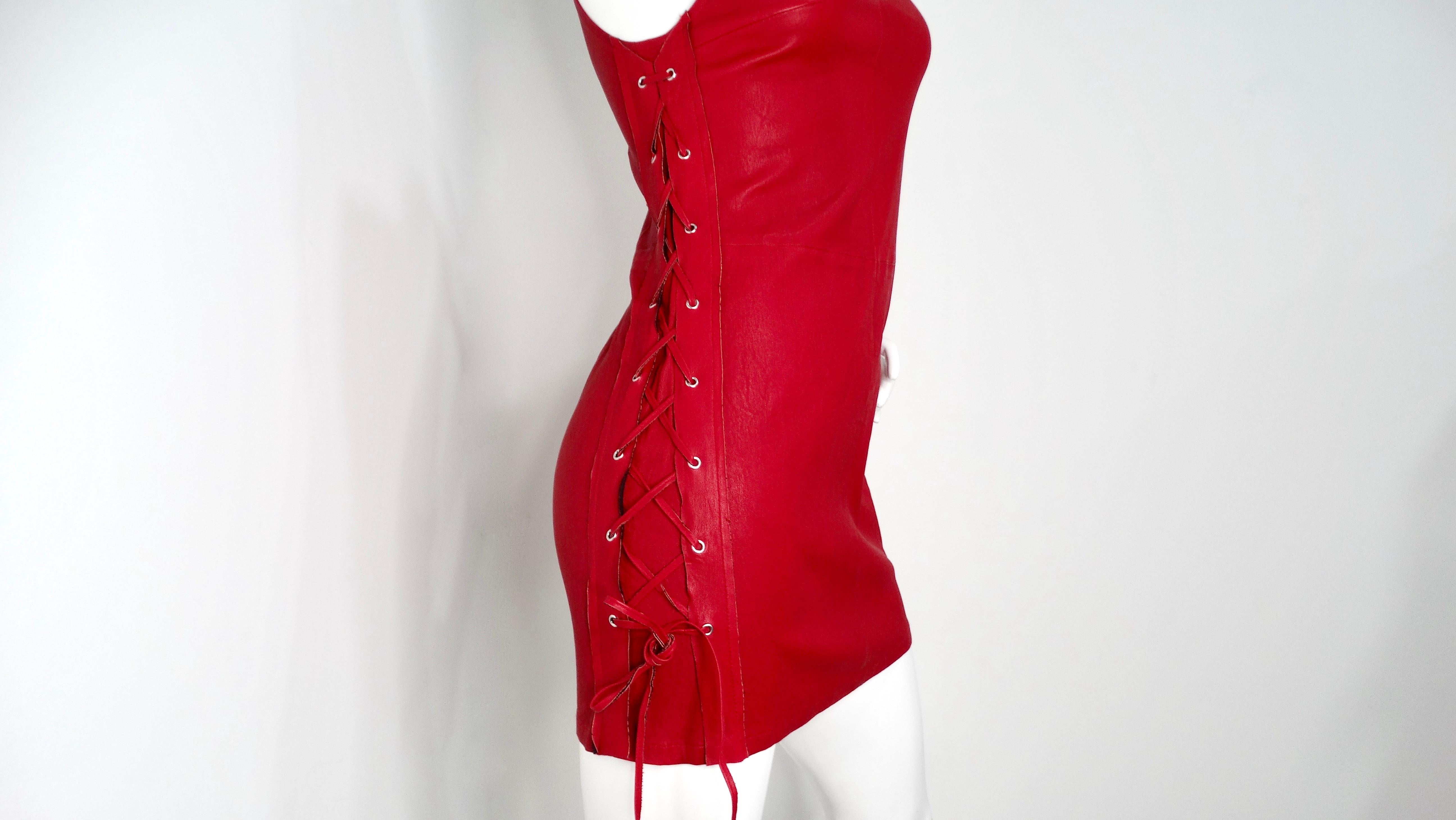 The RTA Lipstick Fifi Lace-Up Leather Dress is a bold and daring piece that redefines contemporary chic. Crafted from high-quality leather, this sleeveless dress features an alluring lace-up detail on one side that adds a unique touch, bringing an