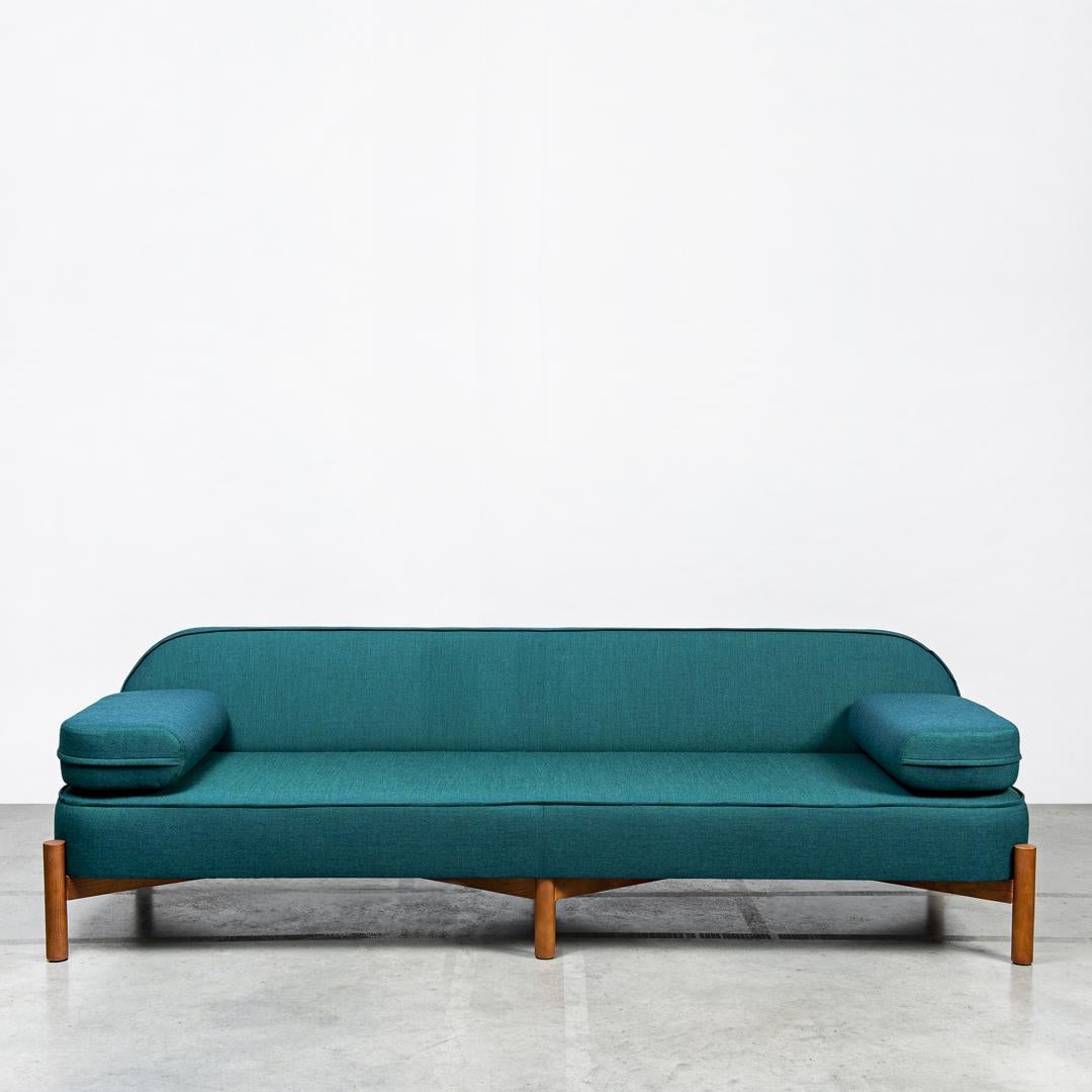 RUA CHA Sofa by Clementine Caurier
Dimensions: D 95 x W 240 x H 74 cm.
Materials: Ash, wool, and linen.

RUA CHA sofa is based on a light, crossed structure in solid wood.
The generous curves are first padded with high-density memory
foam and then