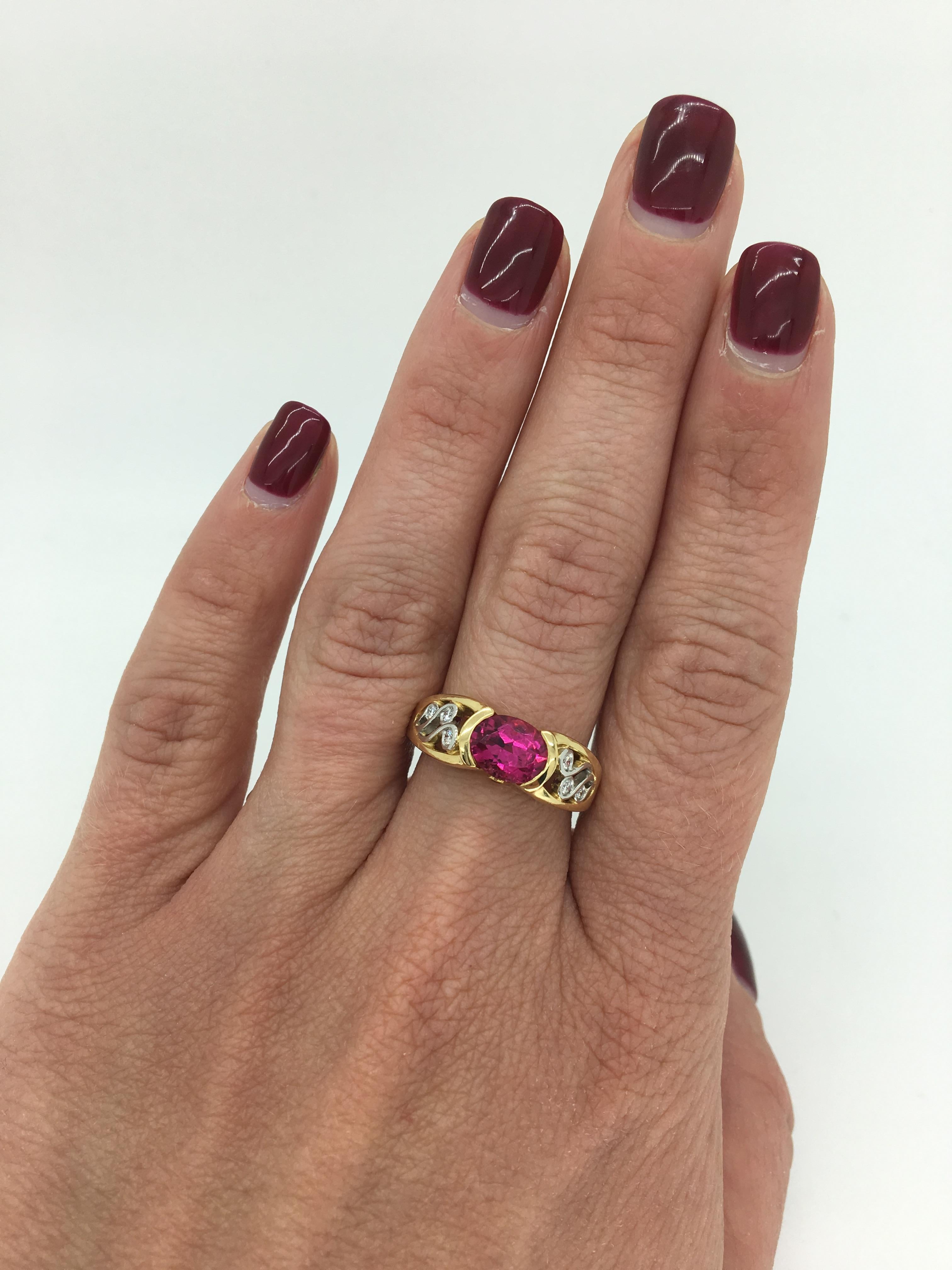 This 18K yellow gold ring features a vivid oval shaped Rubelite gemstone, 6 Round Brilliant Cut Diamonds and two Round Emeralds beautifully accent the featured stone.

Gemstone: Rubellite, Diamond and Emerald
Diamond Carat Weight: Approximately