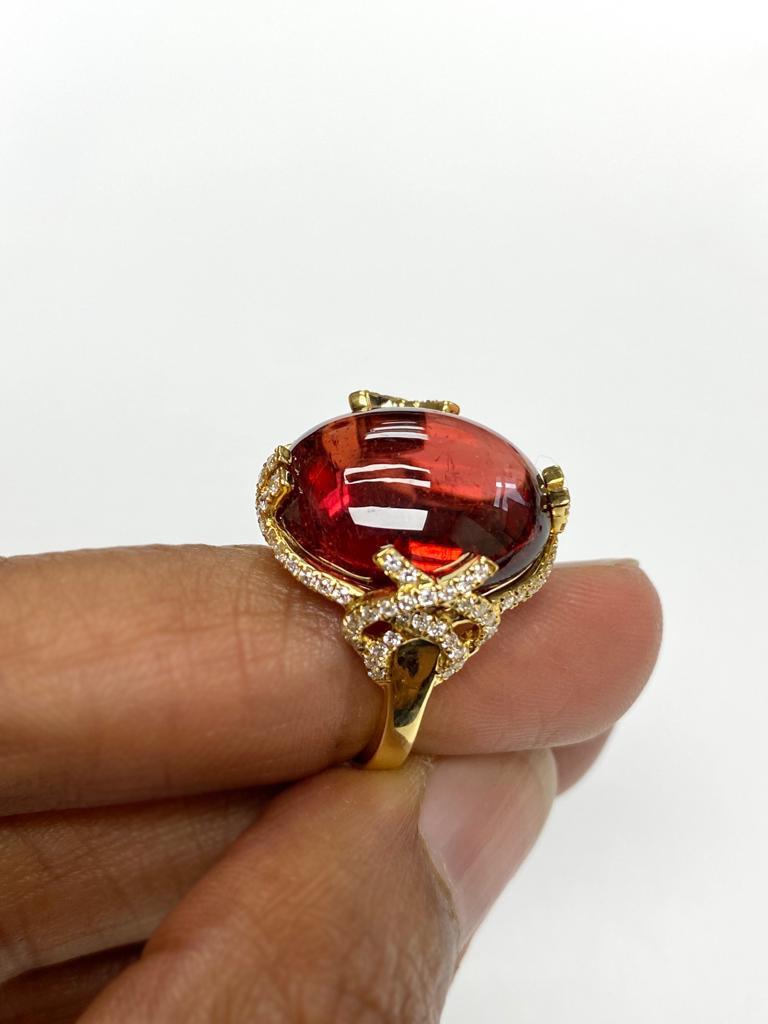 Rubelite Cabochon  'X' Prong Ring with Diamonds in 18K Yellow Gold, from 'G-One' Collection

Stone Size: 17 x 14 mm

Gemstone Weight: 15.28 Carats

Diamonds: G-H / VS, Approx Wt: 0.53 Carats
