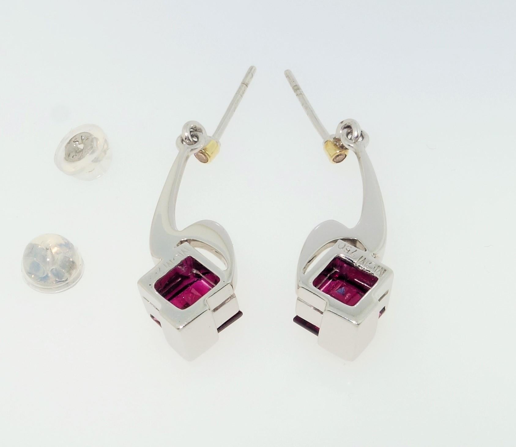 Simply Beautiful, Elegant and finely detailed Dangle Drop Earrings, securely nestled with  2.75 Carat square Rubelite Tourmaline, measuring 7mm and accented by Diamonds. Each  size: 30mm long. Hand crafted in Rhodium sterling silver and 18 Karat
