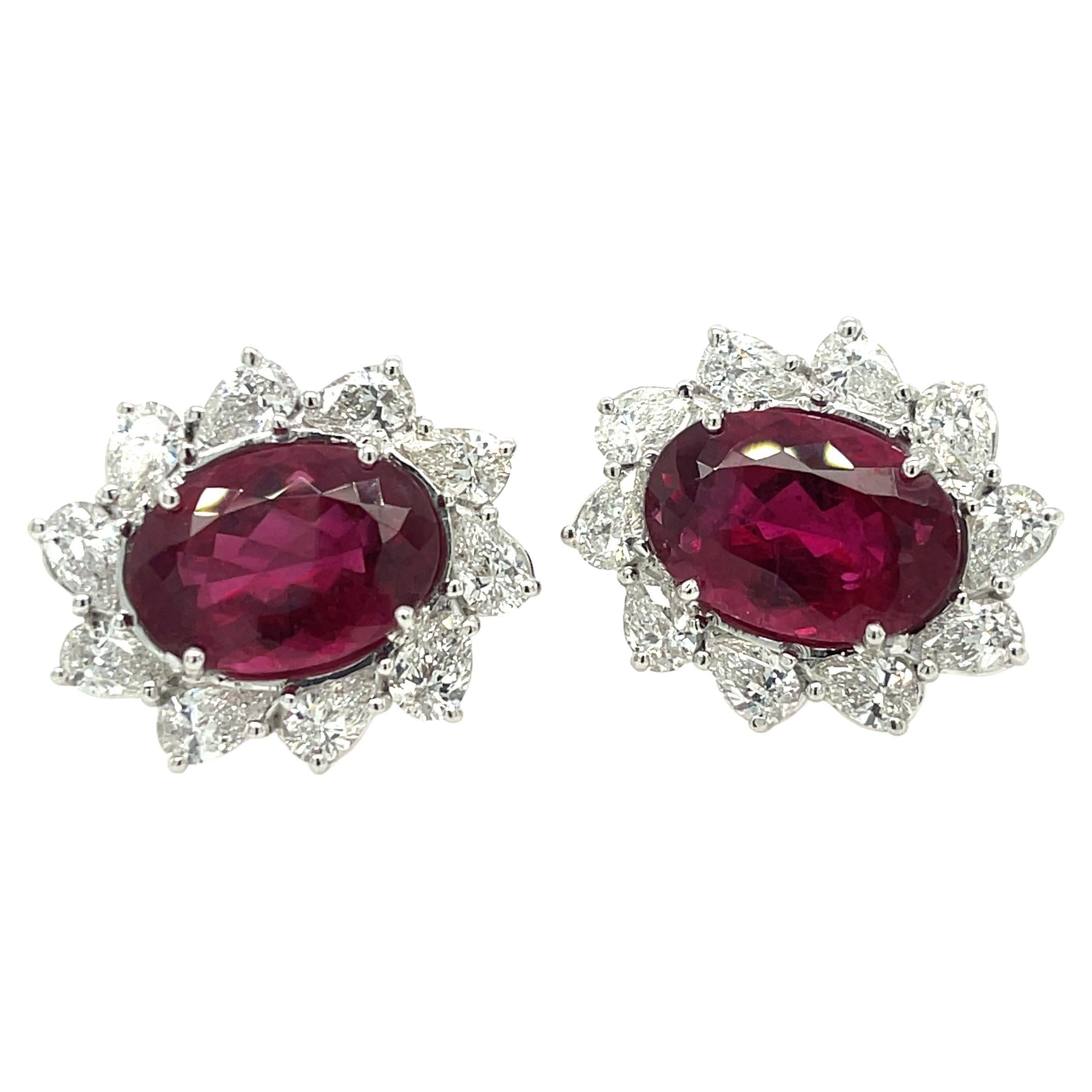Rubellite And Diamond Earrings In 18K White Gold, The Earrings Feature Two Oval Cut Rubellites (12.17Ctw) And 20 Pear Shape Diamonds (3.83Ctw).
1