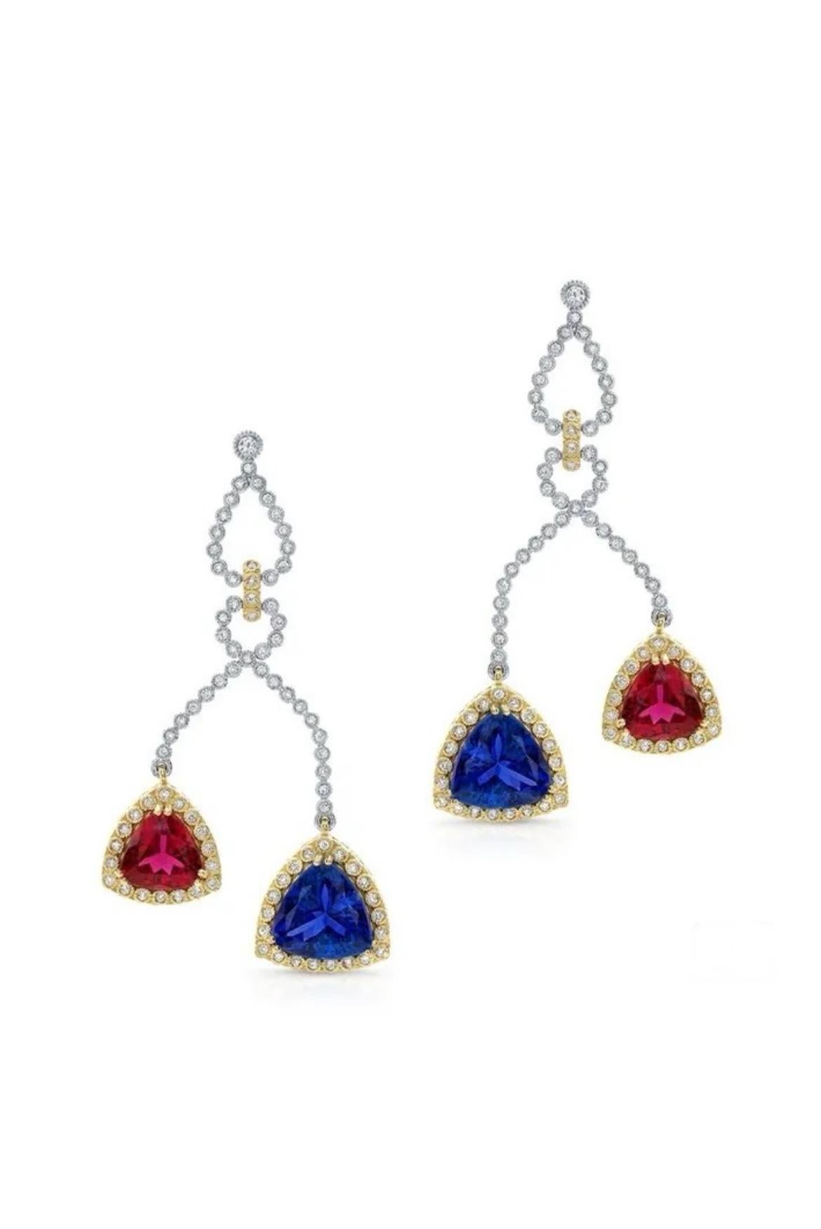 These glamorous earrings showcase 9.20 carats of Tanzanites and 4.50 carats of Rubellite Tourmalines beautifully complemented by 202 white twinkling diamonds totaling 1.30 carats in 18K yellow gold. 