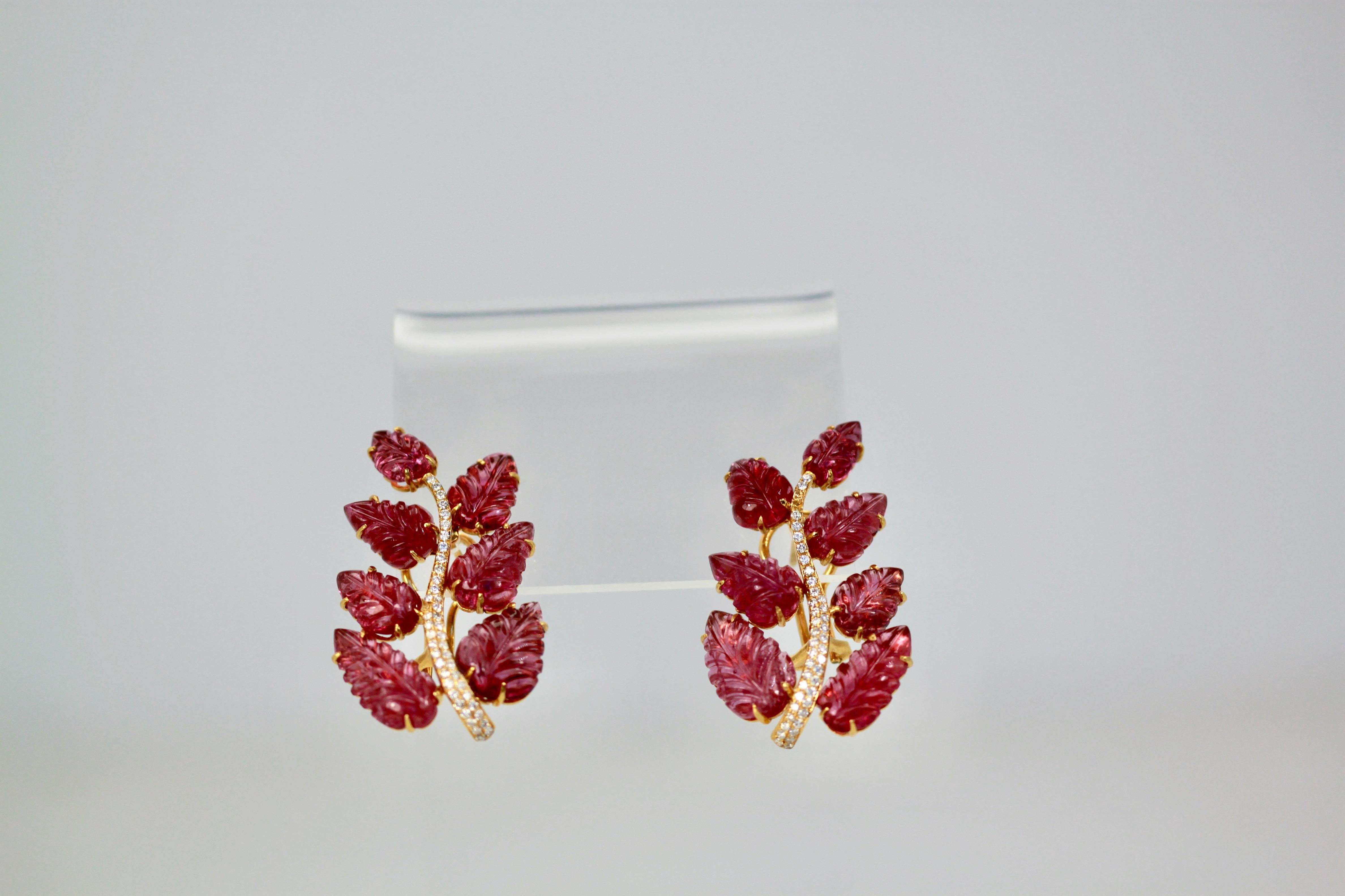 These Rubellite Carved leaf earrings are unique and lovely.  They are 4 cm long with 7 carved Rubellite gemstones each. They are large and distinctive. There are 2 Rubellites at 4 carats, 2 at 3 carats, 2 at 1 1/2 carats and 1 at 3/4 carat each. 