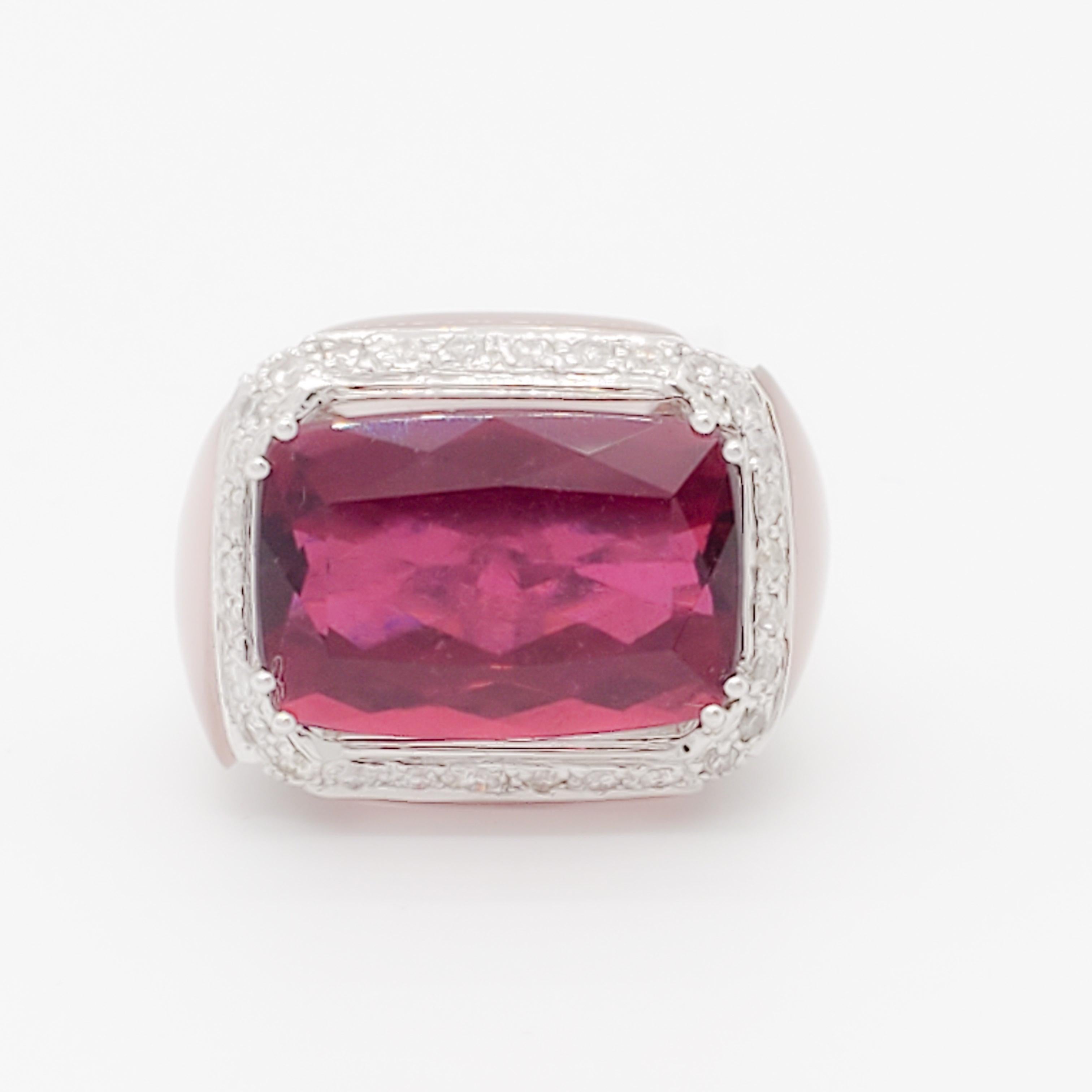 Gorgeous 13.46 ct. rubellite octagon with good quality white diamond rounds and rose quartz on the sides.  Handmade in 18k white gold.  Ring size 7.25.