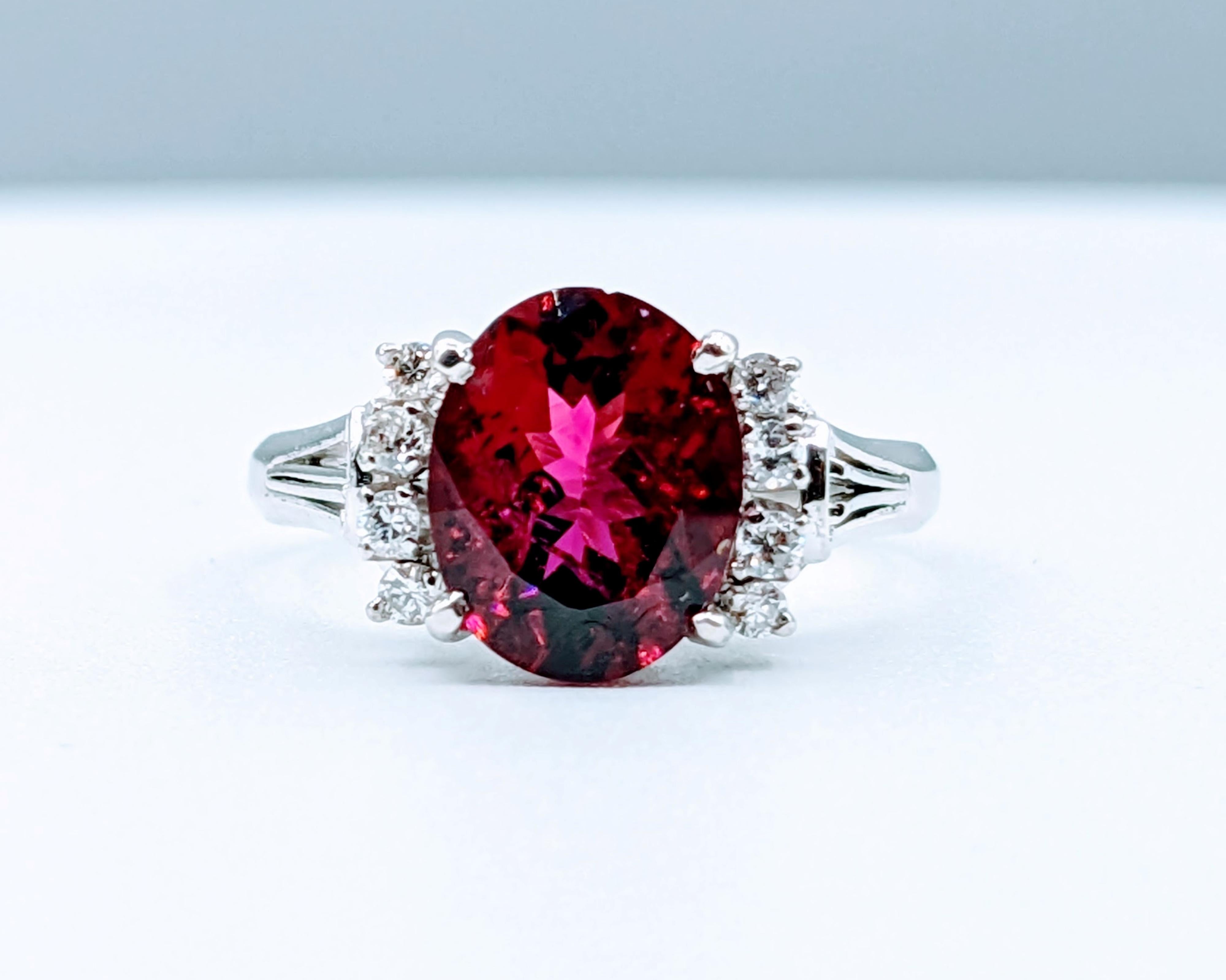 Rubellite & Diamond Platinum Ring

Crafted from 900pt platinum, this exquisite ring showcases a stunning 2.39ct rubellite tourmaline, complemented by 0.15ctw sparkling diamonds of G color and SI1 clarity. The Rubellite tourmaline exhibits a rich,