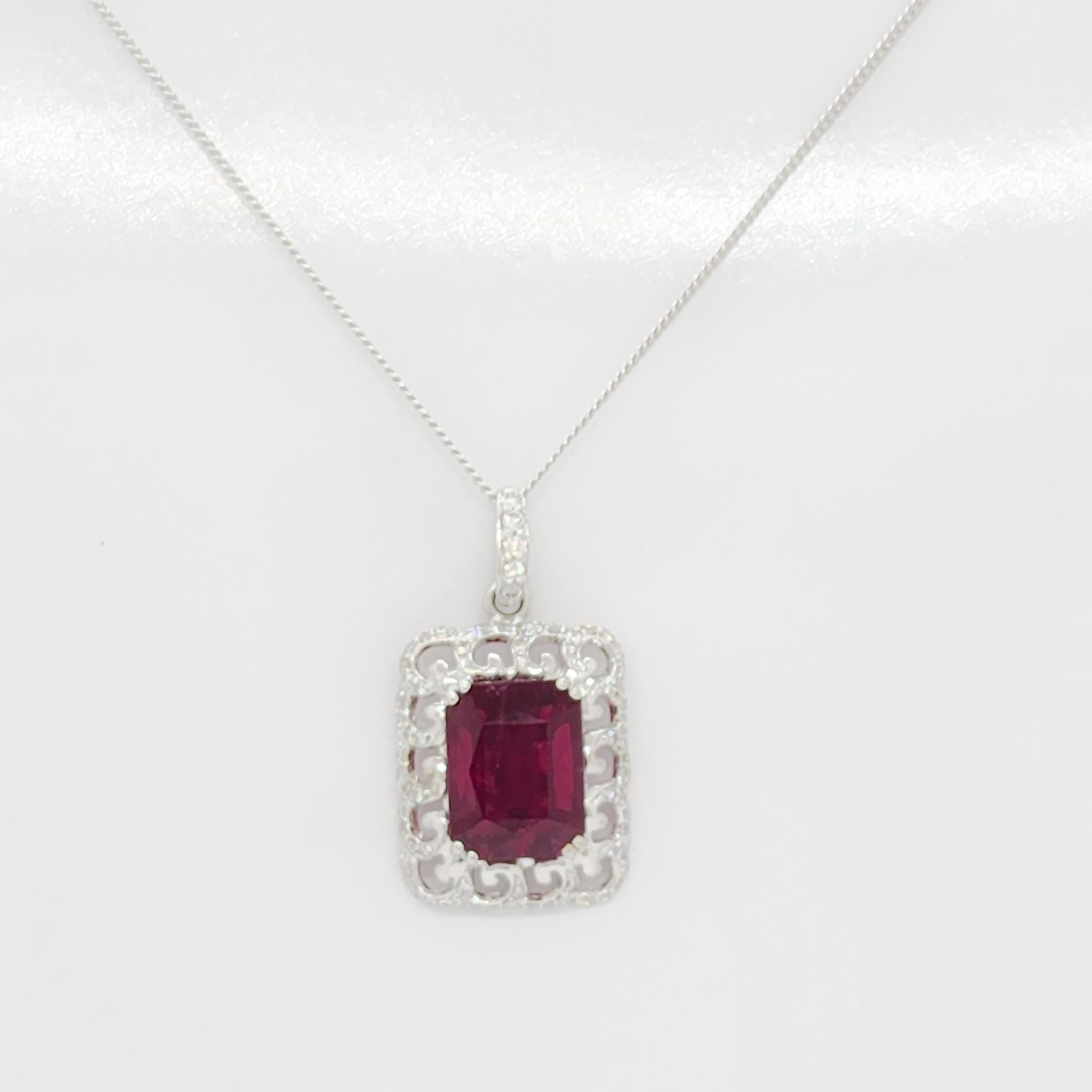 Beautiful 9.83 ct. rubellite emerald cut with 0.85 ct. good quality white diamond rounds.  Handmade in 18k white gold.  Length is 18