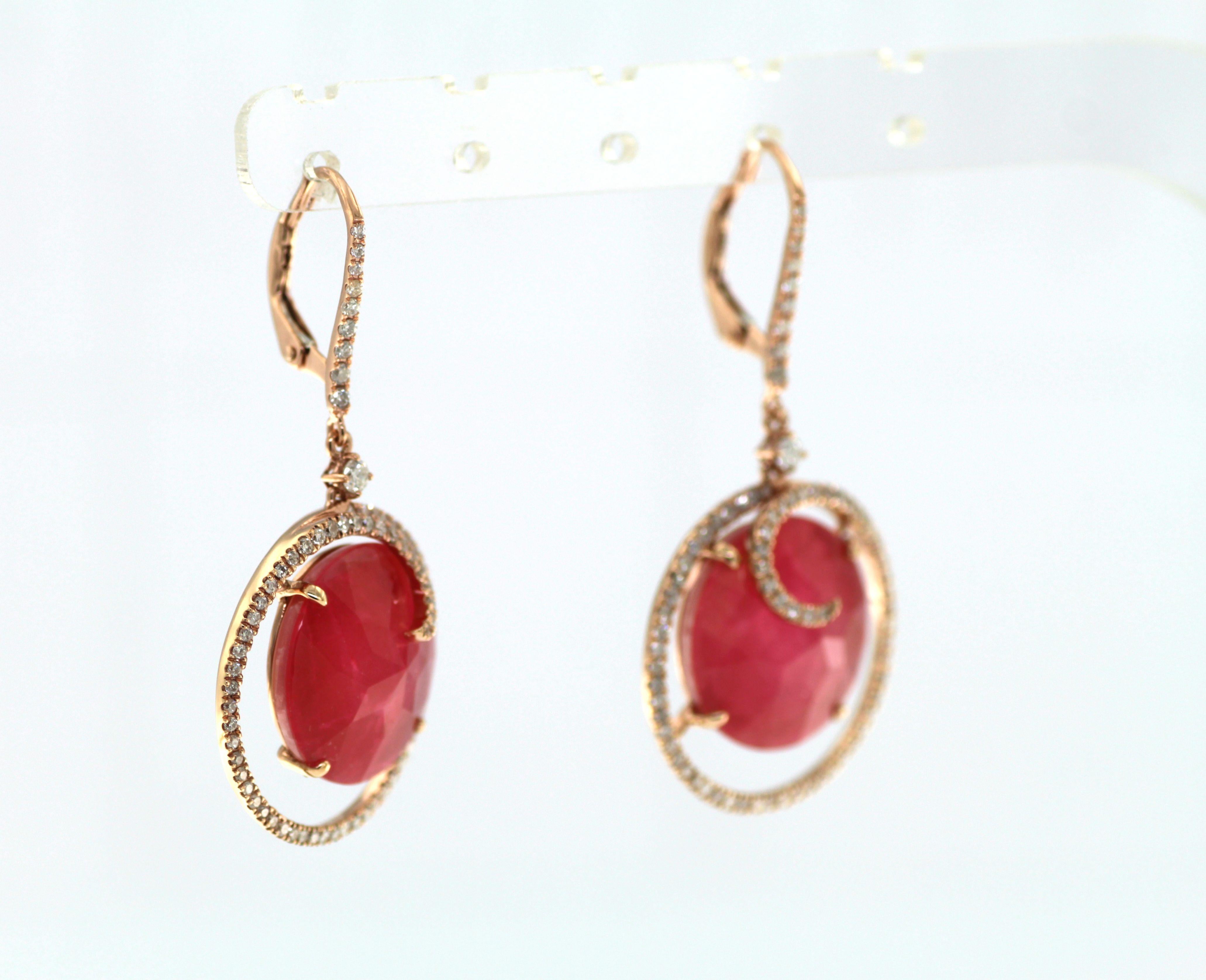 These Rubellite Rock Crystal Doublet Diamond Dangle Earrings are a paragon of elegance and sophistication, perfectly housed in 18 Karat Rose Gold. The primary attraction, the Rubellite and Rock Crystal, boasts a combined weight of an impressive