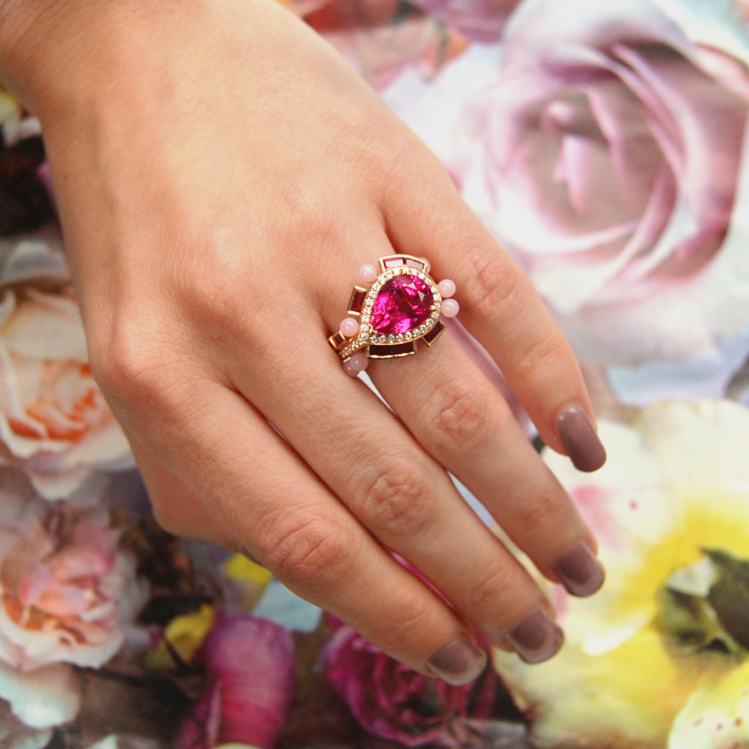 A Rubellite, Ruby, Pink Opal and Diamond Gold Ring in the Wisteria Collection by the Jewelry Designer, Sarah Ho.

A 3.92ct pear cut rubellite is surrounded by pave diamonds, ruby baguettes and opal beads.  This ring is part of the limited Wisteria