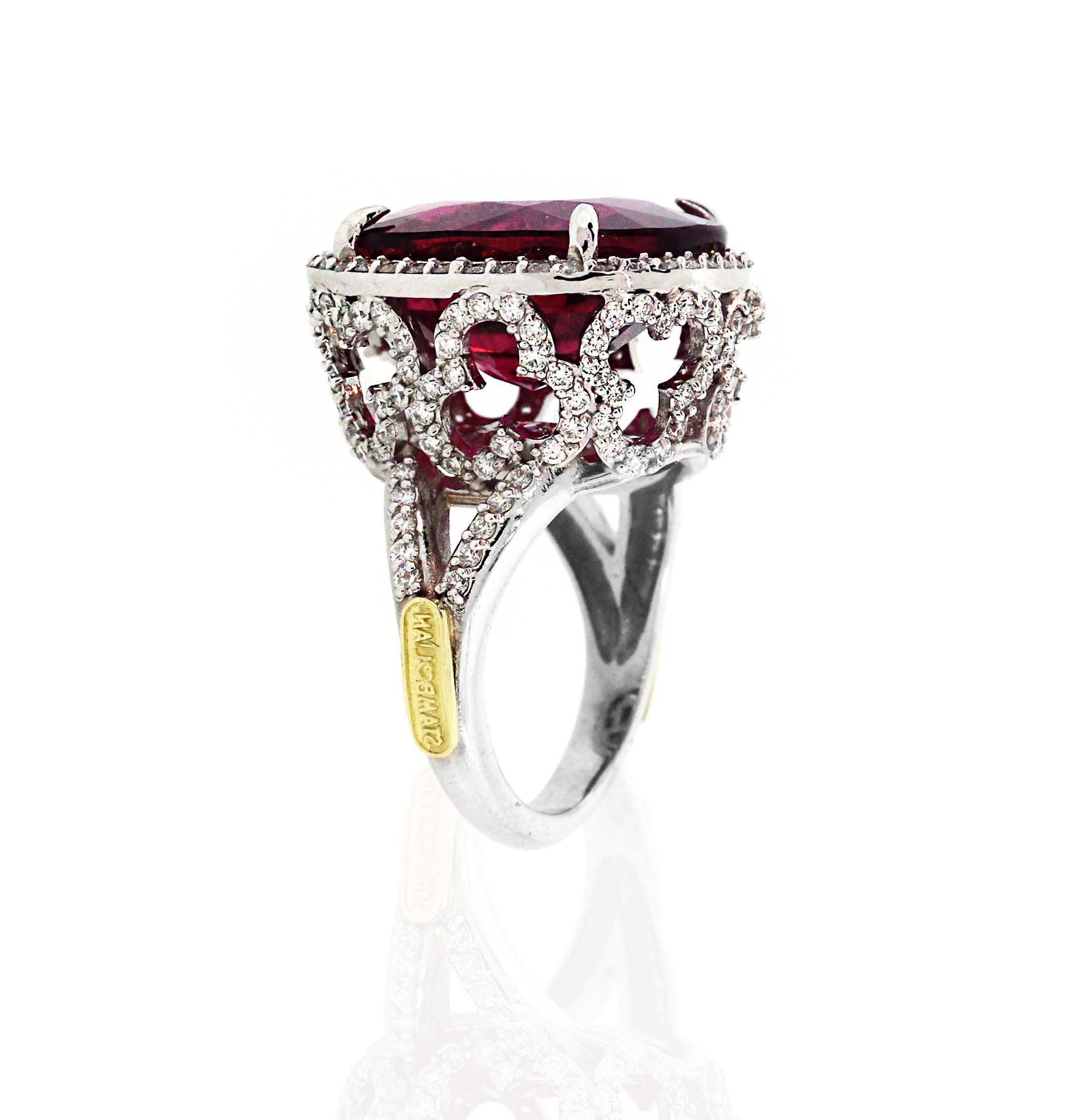 18K White Gold and Diamond Ring with Rubellite Tourmaline center by Stambolian

18.55 carat Collectors Quality Rubellite Tourmaline center

This one-of-a-kind Ring has floral design work all throughout

1.63 carat G color, VS clarity diamonds

Ring