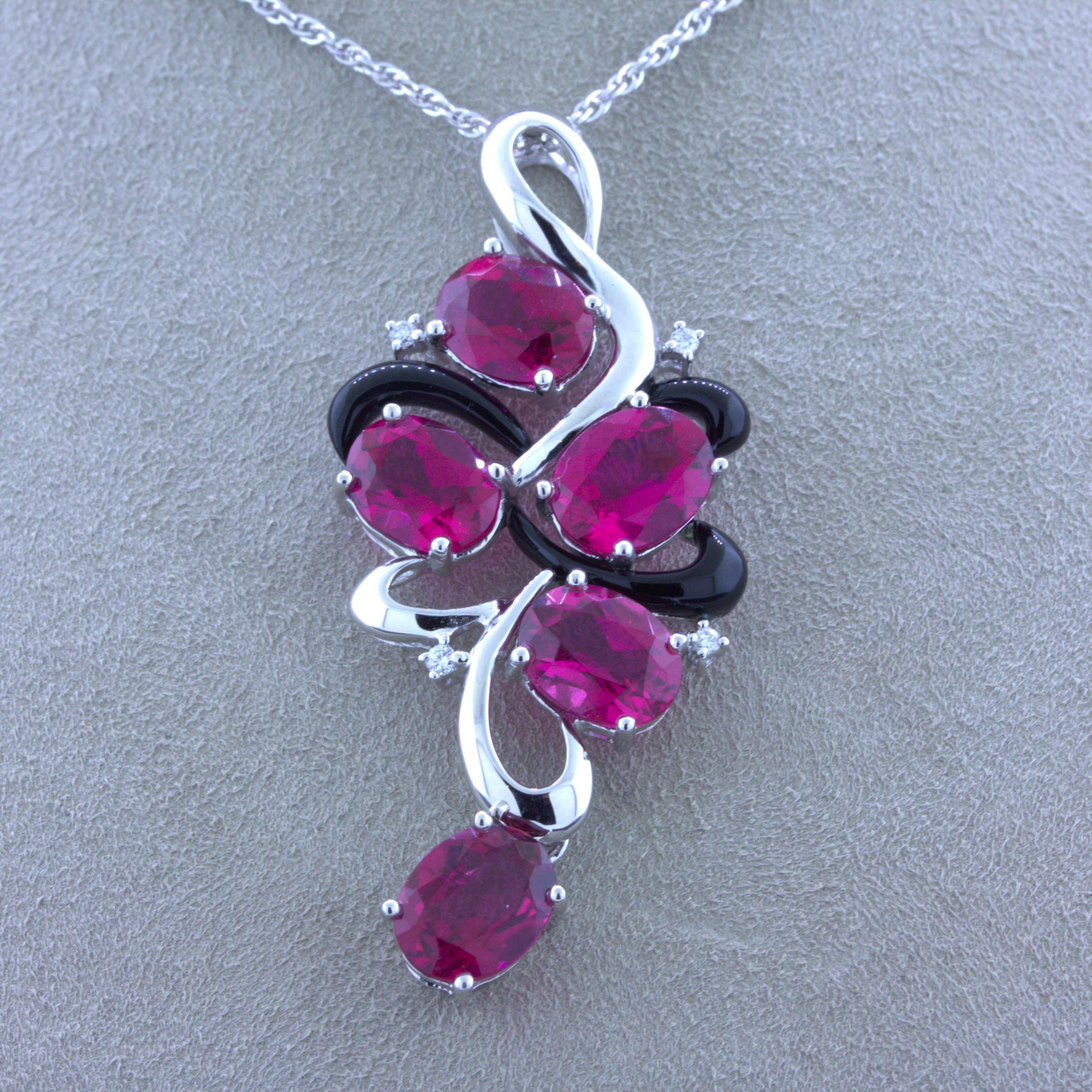A chic and stylish pendant featuring 5 gem oval shape rubellite tourmaline. They weigh a total of 8.82 carats and have a rich intense deep red color that makes rubellite so desirable. They are complemented by 0.08 carats of round brilliant-cut