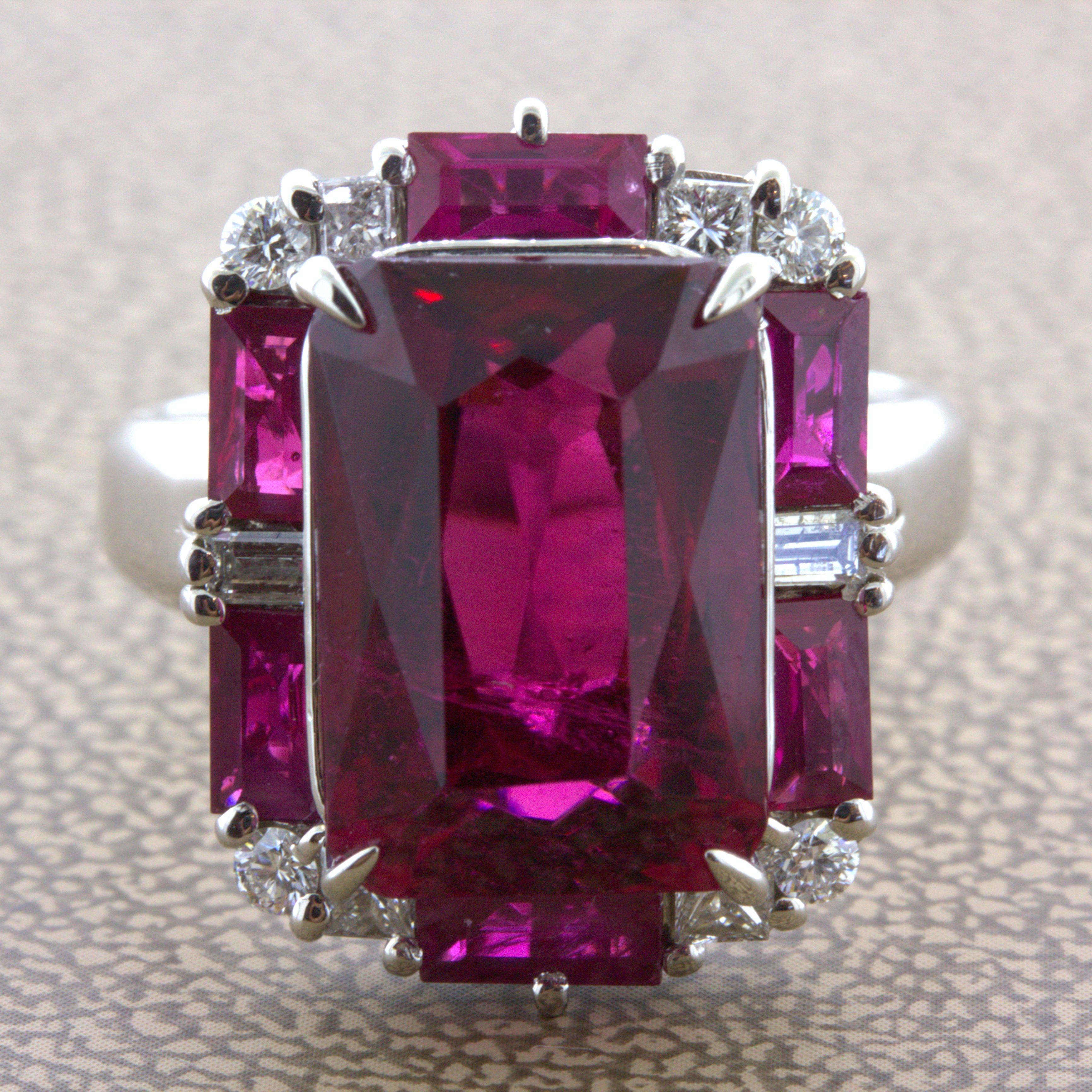 A rich cherry red rubellite takes center stage of this geometric styled piece. The center rubellite weighs 8.62 carats, has superb vivid color, and a sleek emerald-cut shape. It is complemented by a border of diamonds, 0.43 carats, and additional
