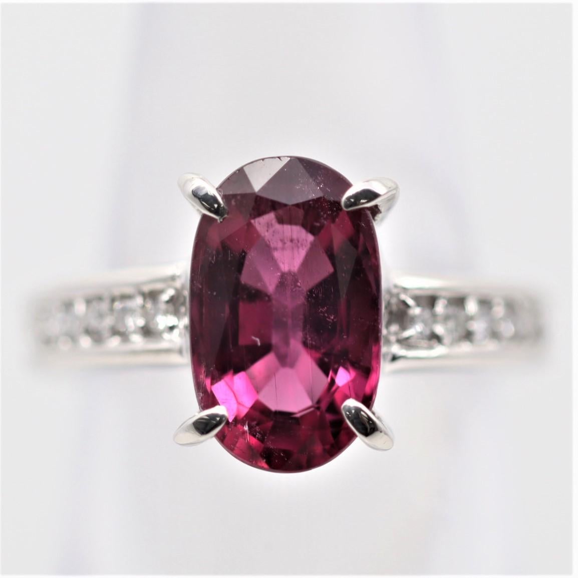 A 3.59 carat gem rubellite tourmaline with a vivid red color takes center stage. It is free of eye-visible inclusions allowing the stones natural color to shine. It is accented by 0.15 carats of diamonds set on its shoulders adding brilliance to the