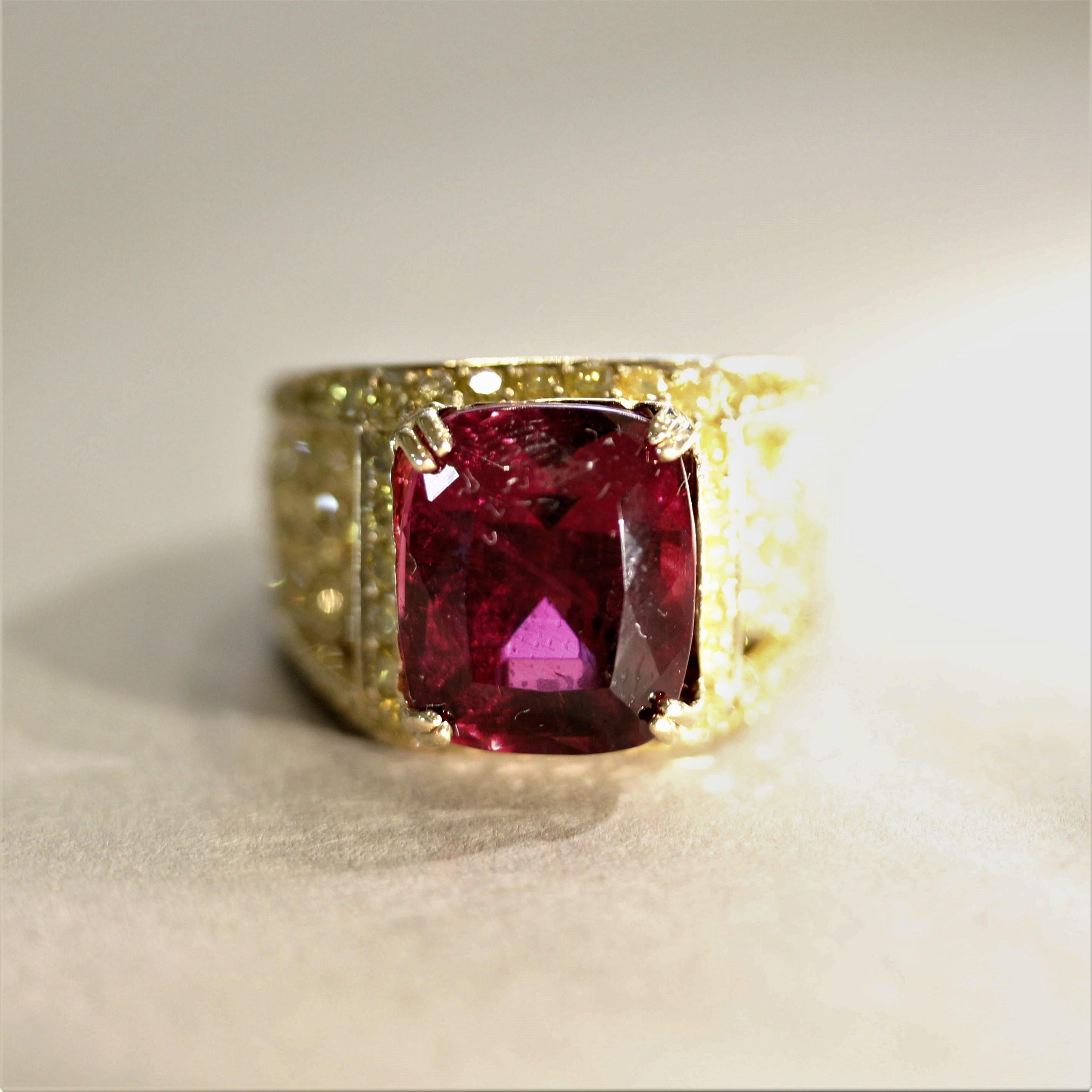 Simply mesmerizing! A superb top-quality rubellite tourmaline takes center stage. It weighs 9.43 carats and has an intense vivid red color that rivals any other rubellite on the market. It is set in a 18k yellow gold ring that is pave-set with 5.88