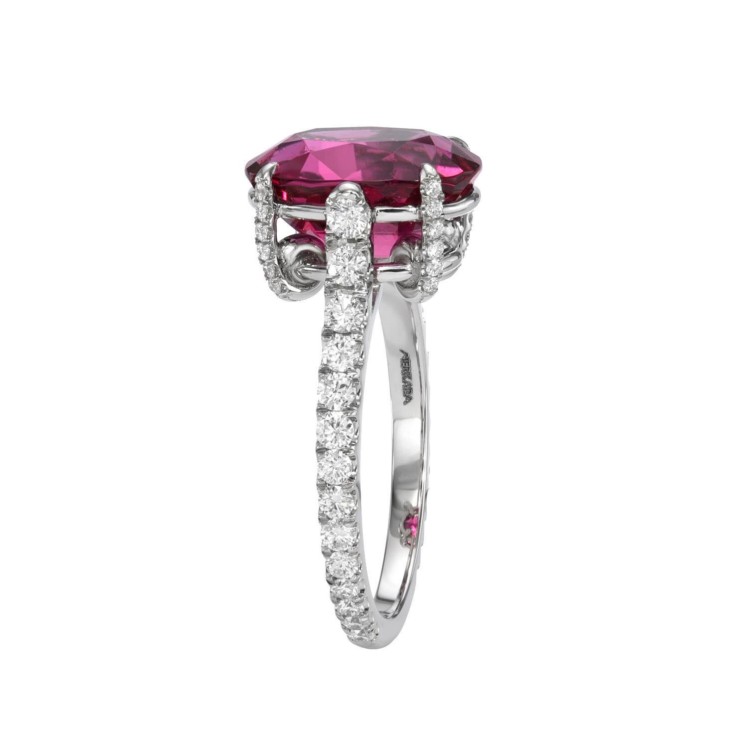 Supreme 3.92 carat Rubelite Tourmaline oval platinum ring, decorated with a total of 0.68 carat round brilliant collection diamonds.
Ring size 6. Resizing is complementary upon request.
Crafted by extremely skilled hands in the USA. 
Returns are