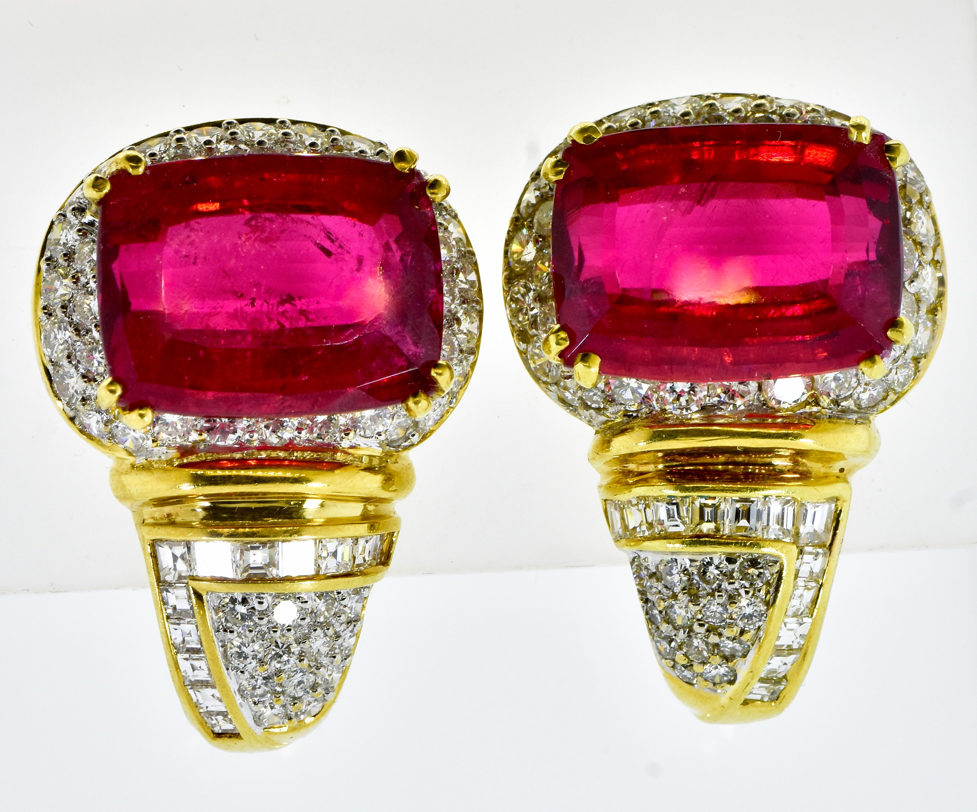 Red Tourmaline and fine diamond earrings. The fine natural tourmalines display a red/pink vivid color. Totally these two rectangular cushion cut stones weigh an estimated 25.75 cts.  The stones are well matched and well cut, one is very slightly