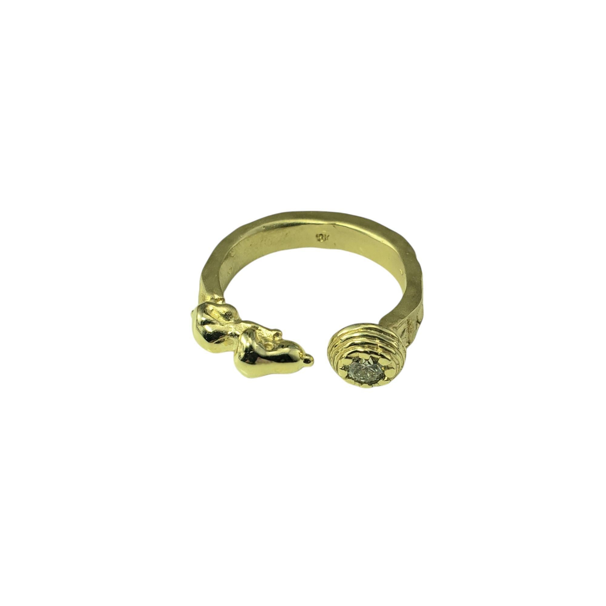 Ruben Viramontes 18K Yellow Gold and Diamond Beagle Ring Size 8

This 18K yellow gold ring by Disney artist Ruben Viramontes is a whimsical yet luxurious tribute to the beloved beagle. A round brilliant cut diamond sparkles from the dog bowl, adding