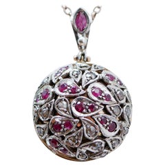 Rubies, Diamonds, 14 Karat Rose Gold and Silver Pendant.