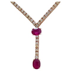 Rubíes, diamantes, collar de tenis de oro rosa de 14 quilates.