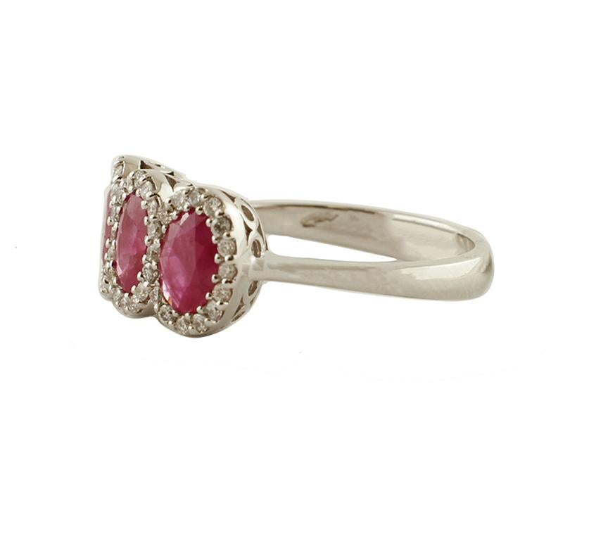 SHIPPING POLICY:
No additional costs will be added to this order.
Shipping costs will be totally covered by the seller (customs duties included).

Elegant modern ring in 18 kt white gold structure mounted with three oval rubies. Each of one is