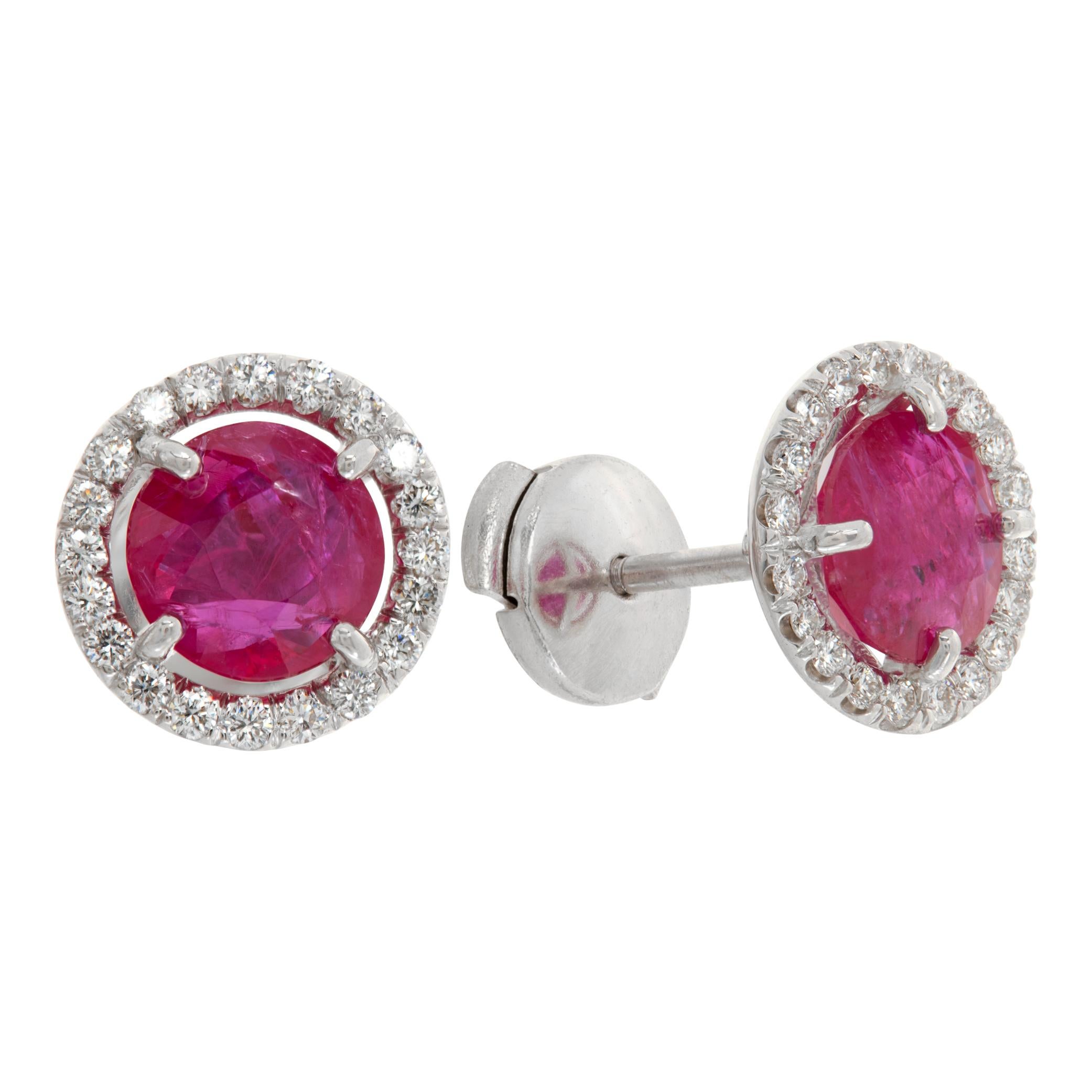 Round Brilliant cut rubies studs, in 18K white gold diamonds Halo setting. Round brilliant cut african rubies total approx. weight: 2.82, Round brilliant cut diamonds total approx. weight: 0.35 carat, estimate: H Color, SI Clarity. 10 mmm diameter.