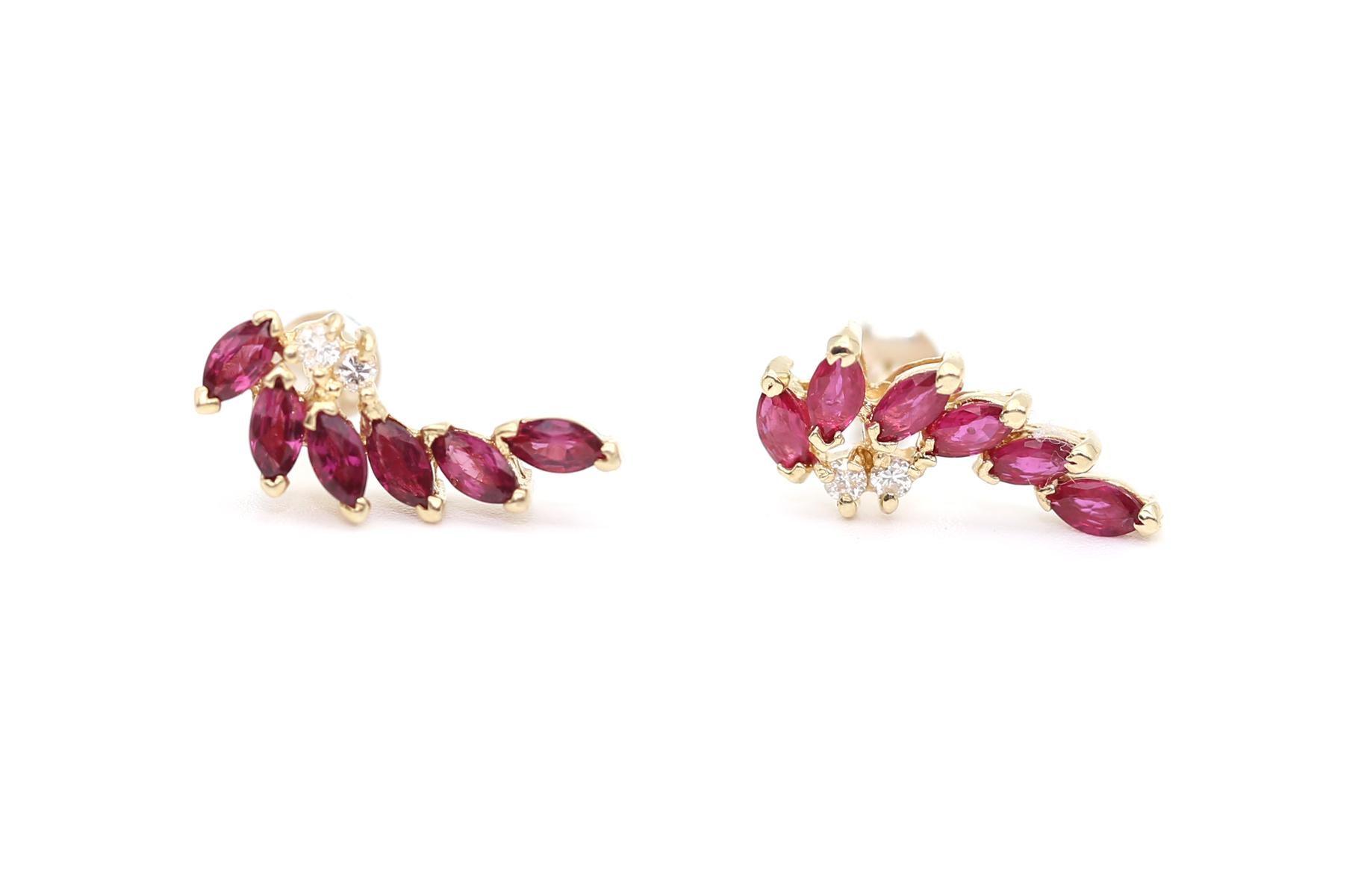 Rubies Diamonds 18K Yellow Gold.
Each earring comprises 6 marquise-cut Rubies. The design of the earring follows the line of the ear, underlining the shape. 2 fine round cut Diamonds. The lock is invisible from the outside so it appears as if the