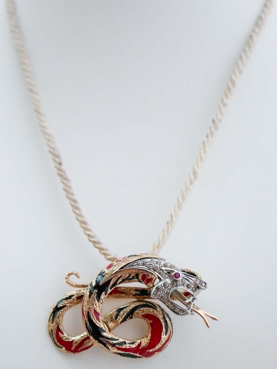 Fashion dragon shape brooch in 9 kt rose gold and silver structure mounted with a ruby as eye. The head is studded with diamonds and, on the body, black and red enamel.
This brooch was totally handmade by Italian master goldsmiths and it is in