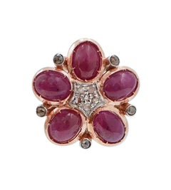 Boucles d'oreilles en or rose, rubis et diamants.