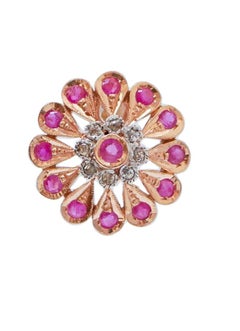 Rubini, diamanti, oro rosa e argento.