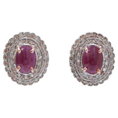 Rubini, diamanti, oro rosa e argento.