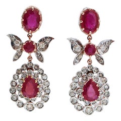 Rubini, diamanti, oro rosa e argento.