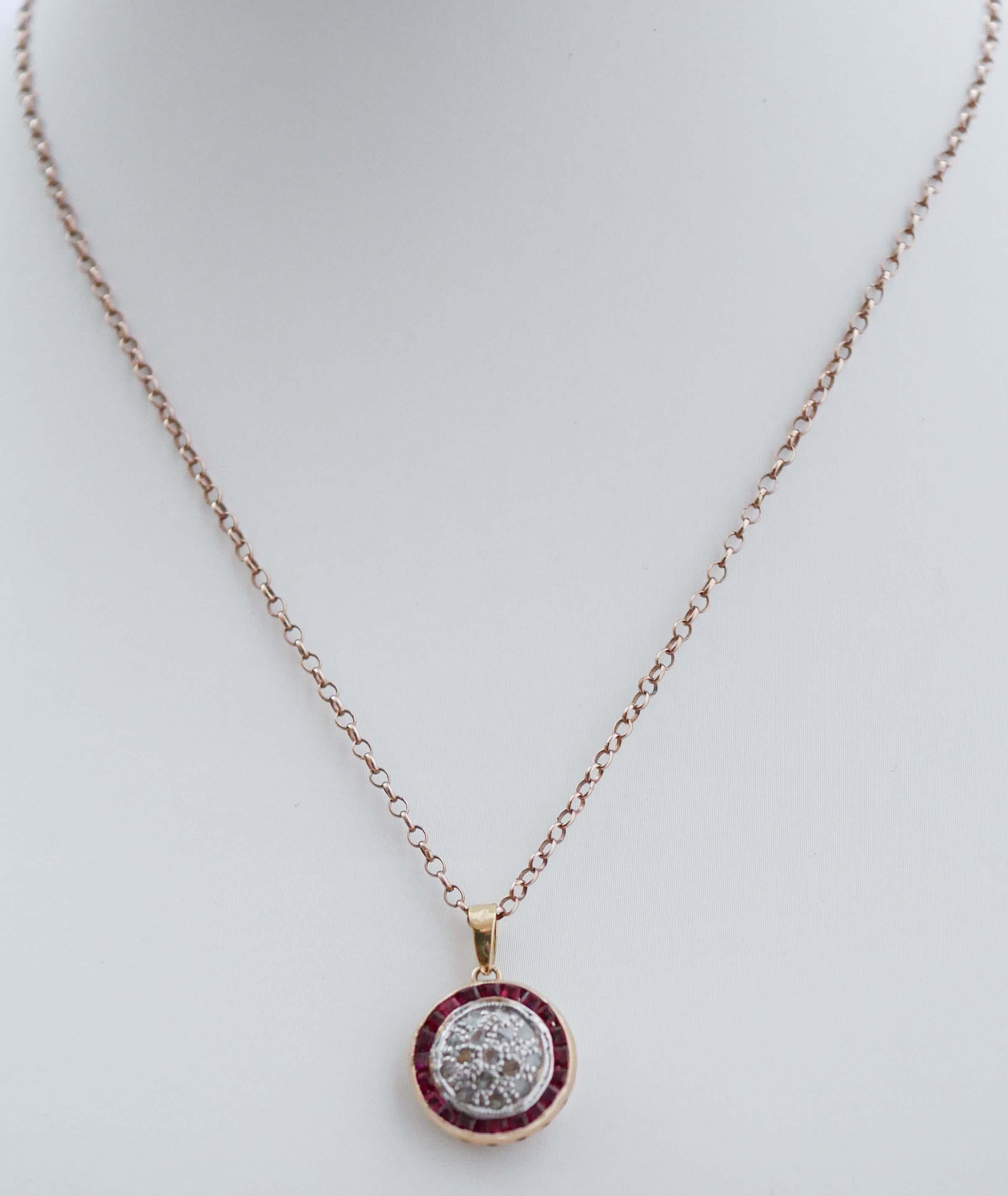 Retrò pendant in 9 kt rose gold and silver structure mounted with diamonds in the central part surrounded by rubies.
The pendant will come with a rubber chain.
This pendant was totally handmade by Italian master goldsmiths and it is in perfect