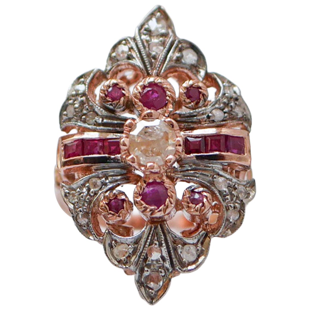 Anello con rubini, diamanti, oro rosa e argento.