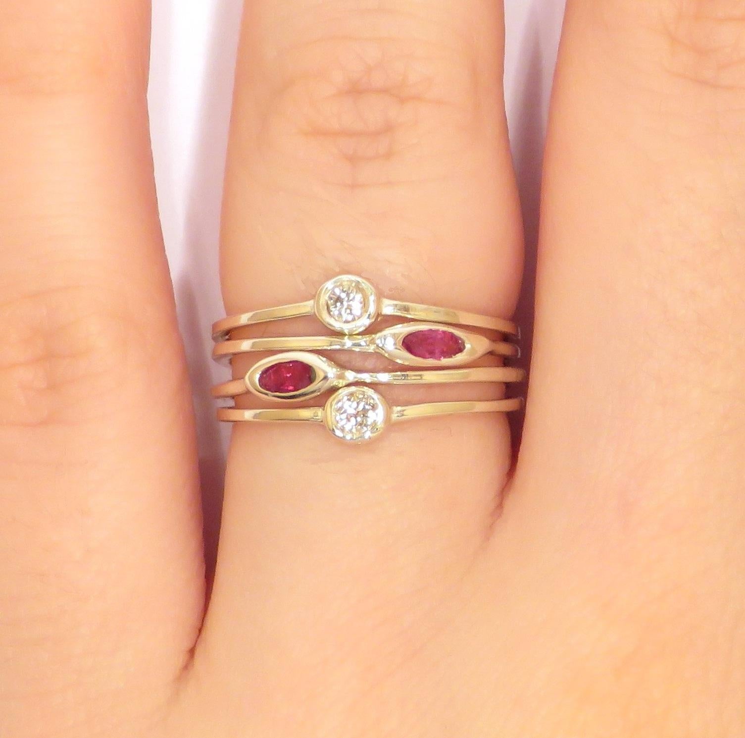 Modern stacking rings in 9 karat white gold with natural navette cut rubies and round cut  white diamonds. The price of this item is for four stacking rings and it is composed by four rings with 2 diamonds round cut and 2 rubies navette cut.
US
