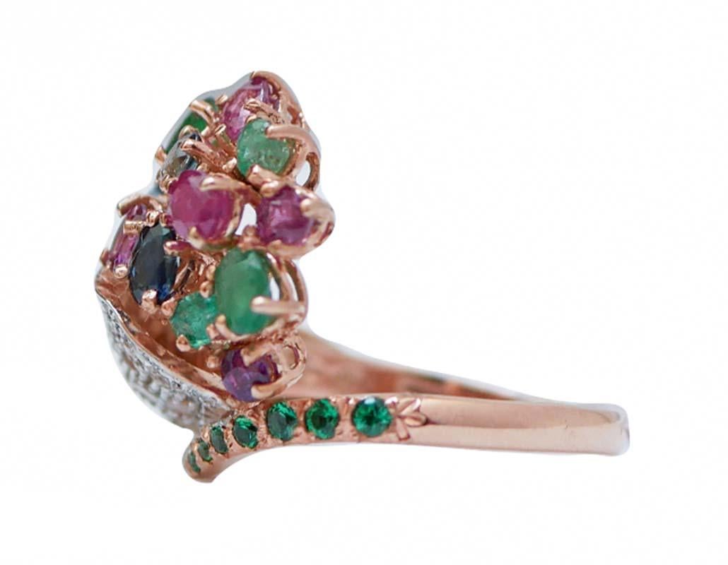 Amazing ring in 9 kt rose gold and silver structure mounted with rubies, emeralds and sapphires on the head. On the tail, tsavorite and on the body diamonds.
This ring was totally handmade by Italian master goldsmiths and it is in perfect