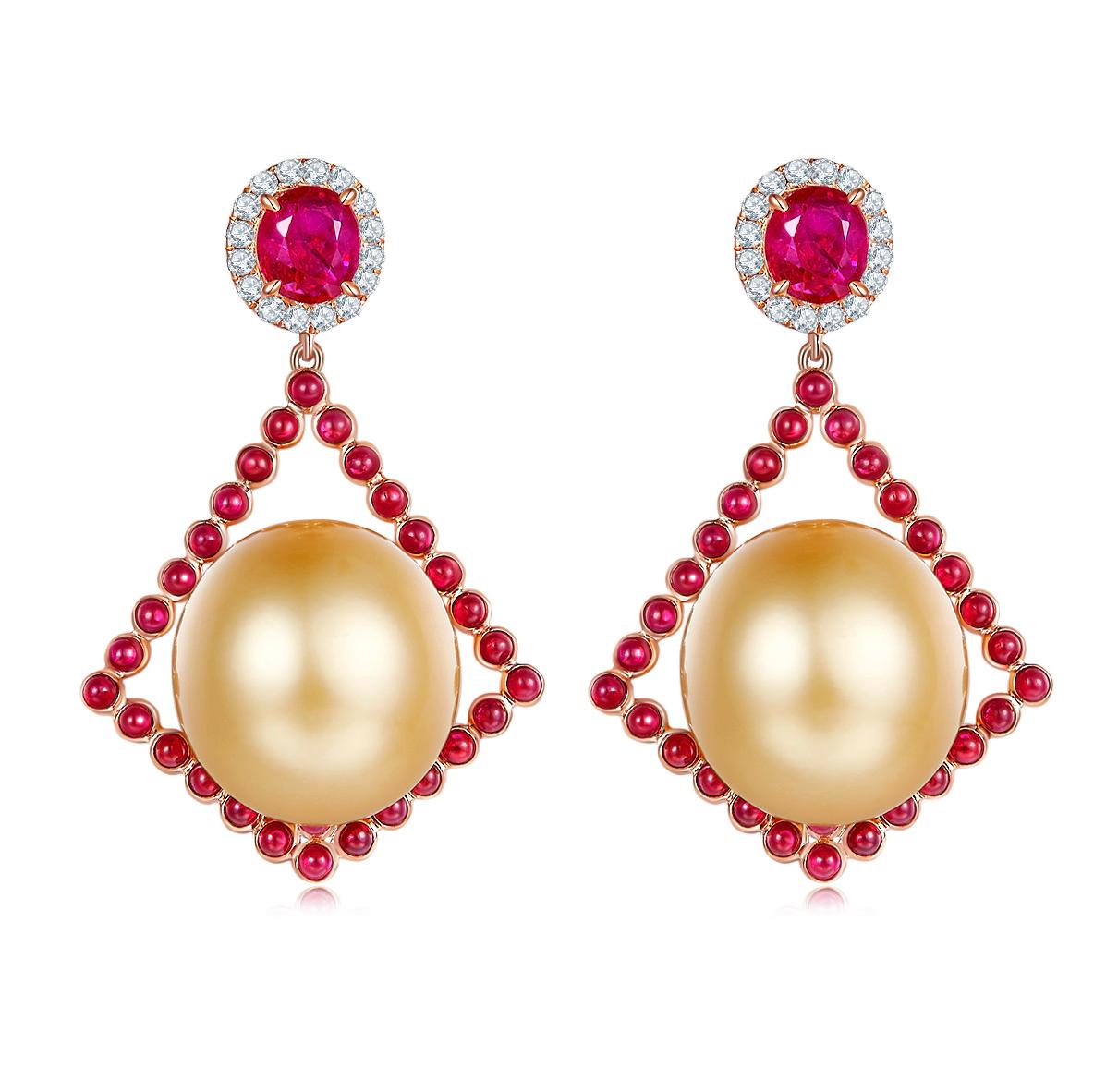 This is a pair of kite shape dangle Earring. The Golden South Sea Pearl is sitting on top of the kite geometric and surrounded by little rubies cabochon. It is then suspended below the oval shape faceted ruby, which is encrusted in a circle of
