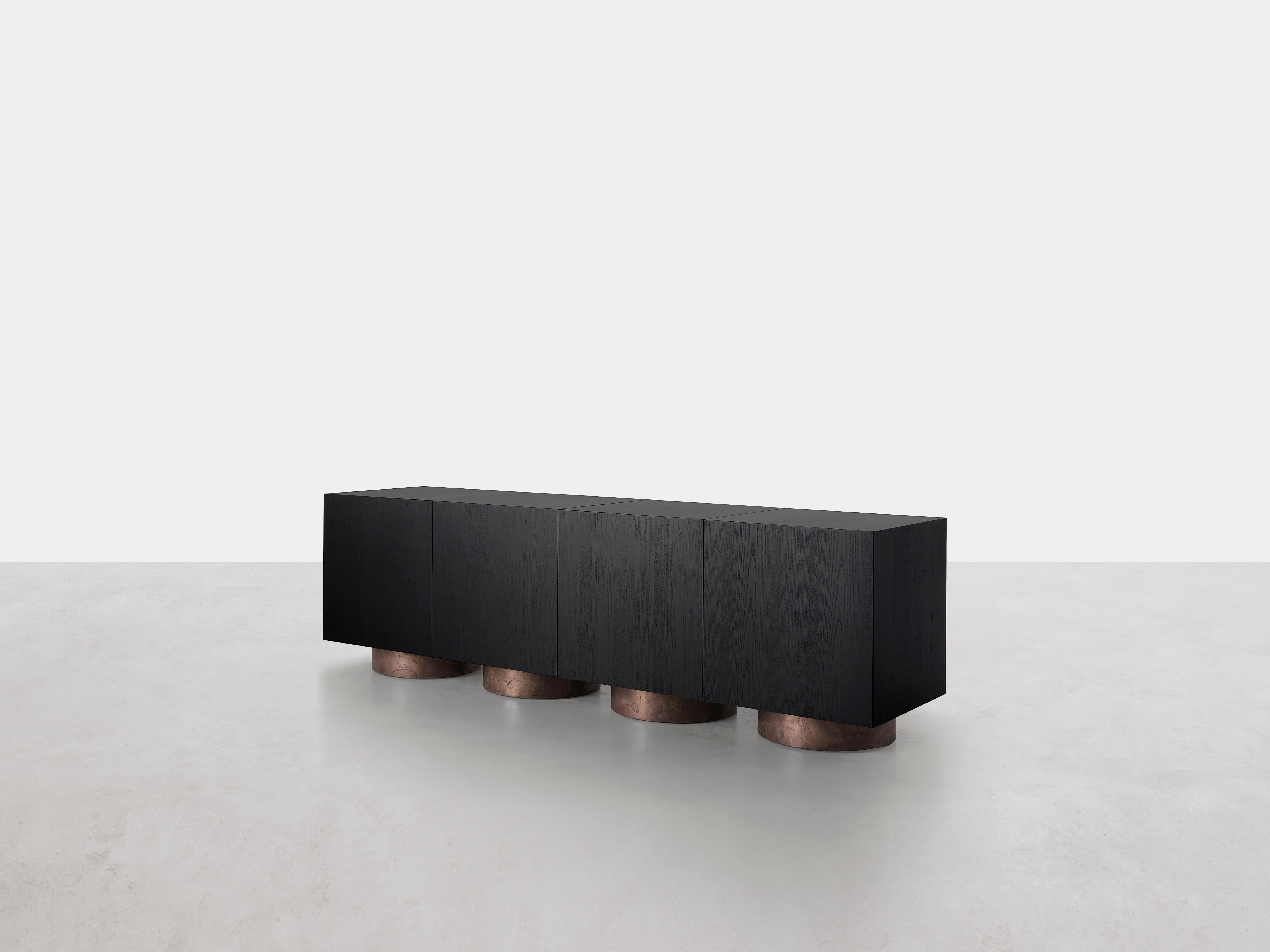 Rubik Container by Somaschini
Dimensions: W 200 x D 50 x H 60 cm
Materials: Plywood structure and door with workmanship at 45 degrees. Doors with push-pull system opening. Internal compartment with bronze glass shelf. The element is modular as