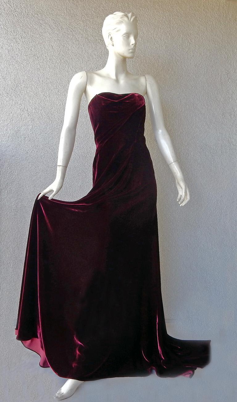 Rubin Singer is  known for creating special event glamour gowns, and this one is no exception.  Fashioned of rich deep wine velvet expertly draped onto the body with a slight drape to the front of the strapless bodice.  Designed to puddle with back