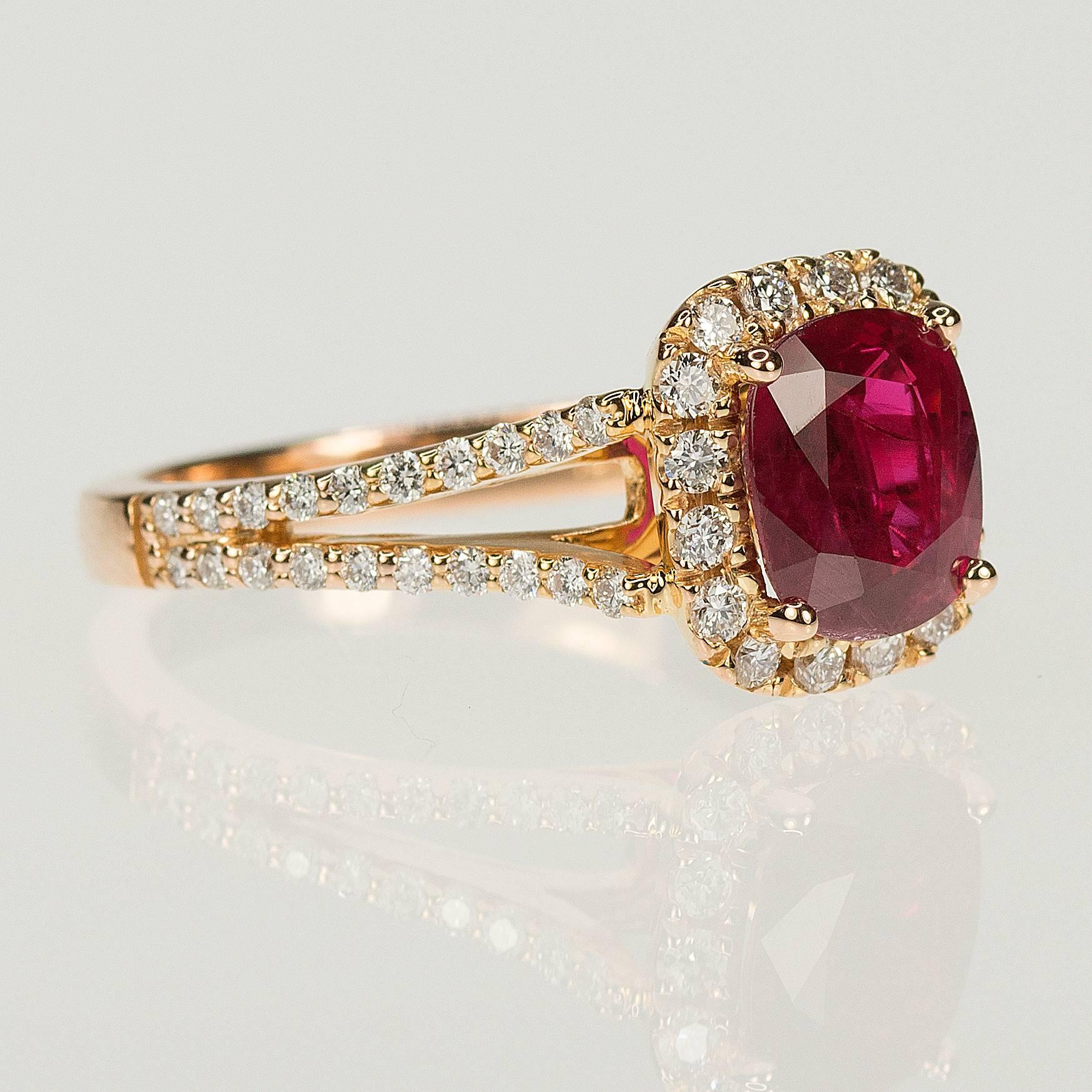 18k Rose Gold Ring with one AGL certified 1.65 carat cushion cut ruby and 56 round brilliant diamonds weighing 0.49 carats.