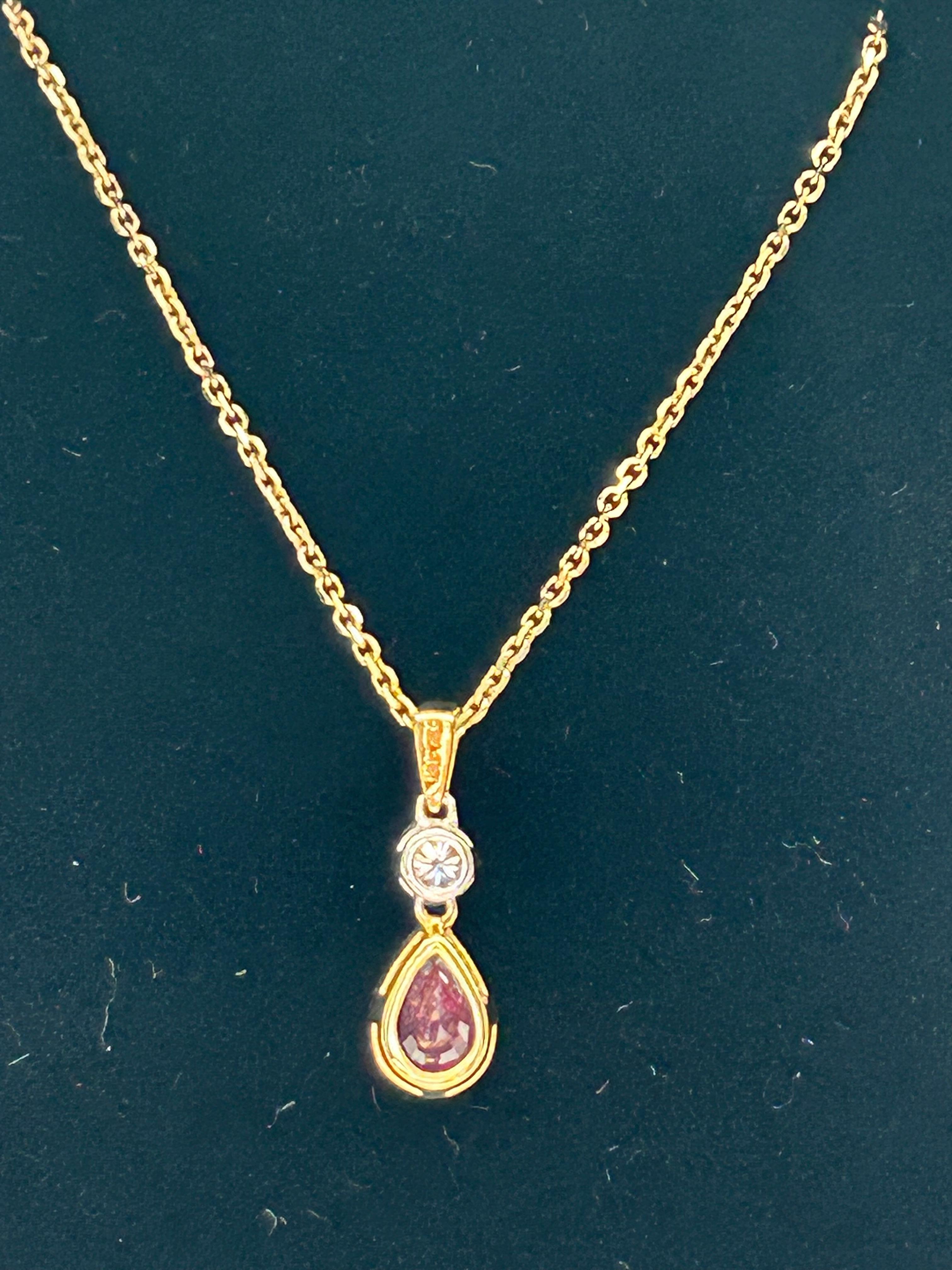 Ruby (0.53ct)  & Diamond (0.06ct) Pendant, 18ct Yellow & White Gold, 9ct Chain. In Excellent Condition For Sale In Canterbury, GB