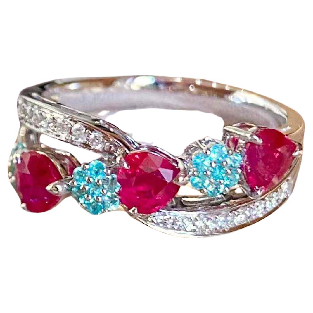 Ruby 1.20ct 
Paraiba 0.10ct 18k White Gold Band Ring