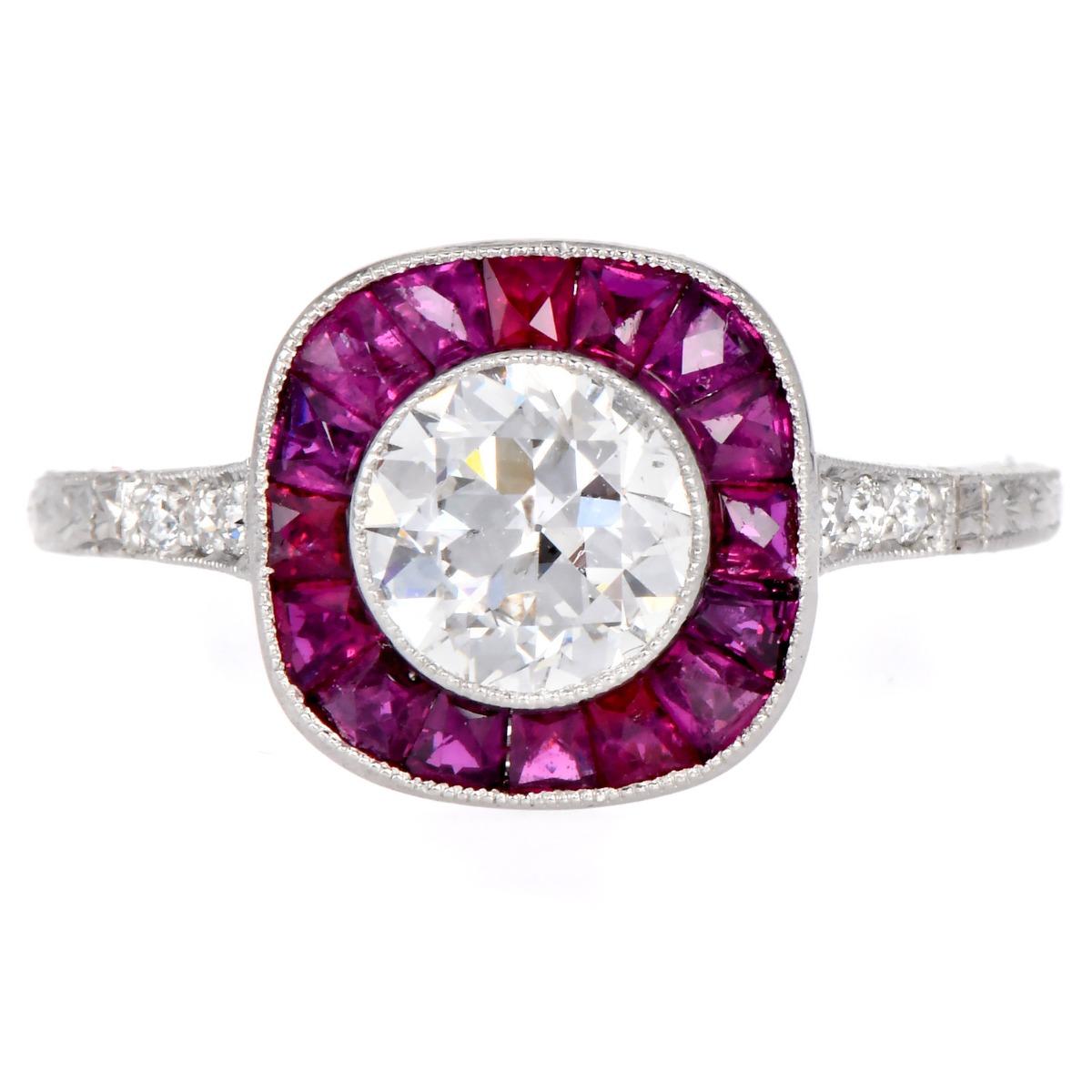 This platinum engagement ring radiates with a vintage charm, featuring a central 1.05-carat round European-cut diamond, SI1 clarity, and G-H color, elegantly framed by calibrated natural rubies.

The band is accented with 0.48 carats of rubies and