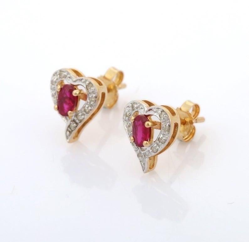 Cast in 18 karat gold, these stud earrings are hand set with .55 carats ruby and .55 carats diamond. 

FOLLOW MEGHNA JEWELS storefront to view the latest collection & exclusive pieces. Meghna Jewels is proudly rated as a Top Seller on 1stdibs with 5